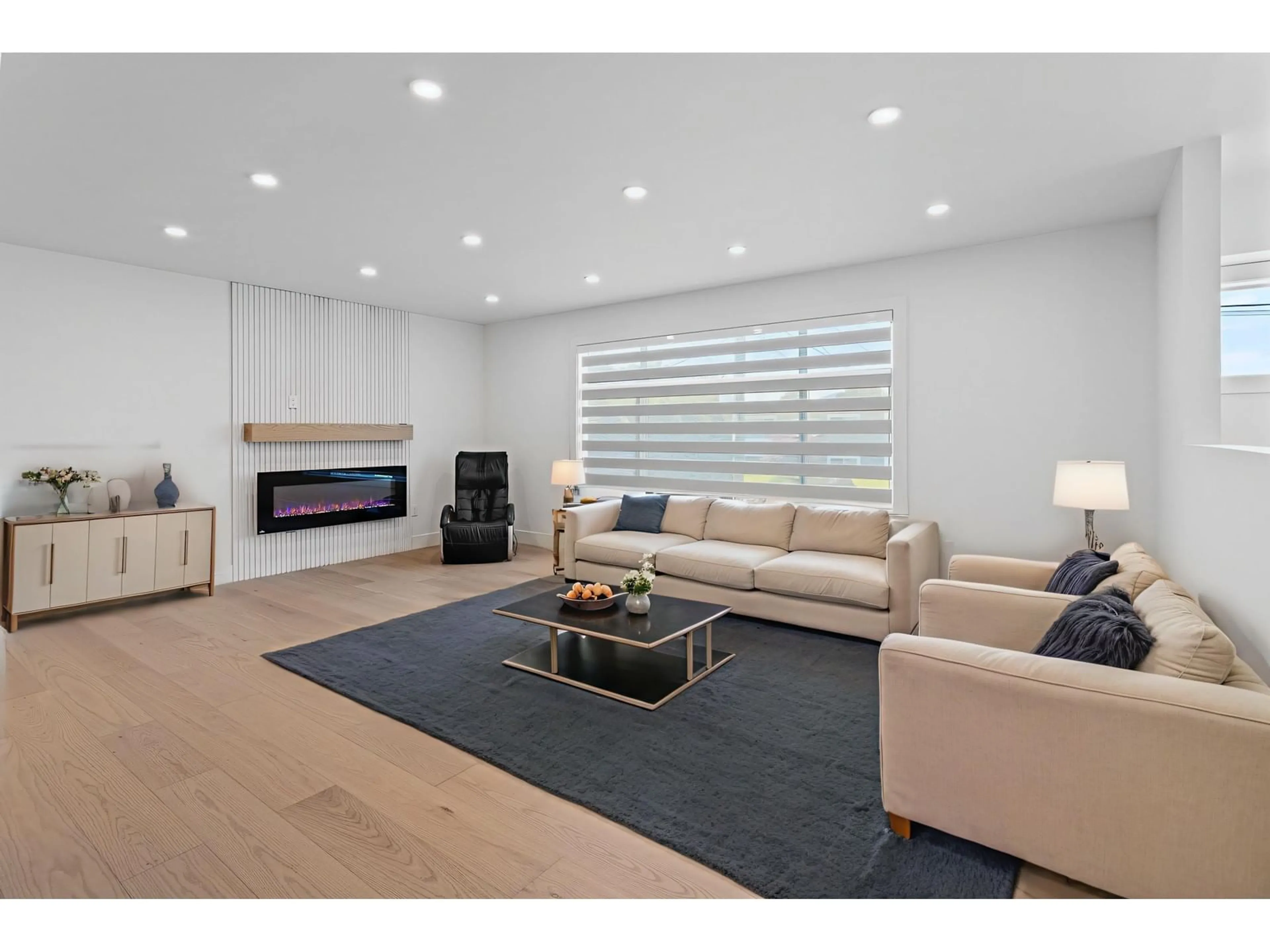 Living room with furniture, wood/laminate floor for 8762 BUTCHART STREET, Chilliwack British Columbia V2P5S3