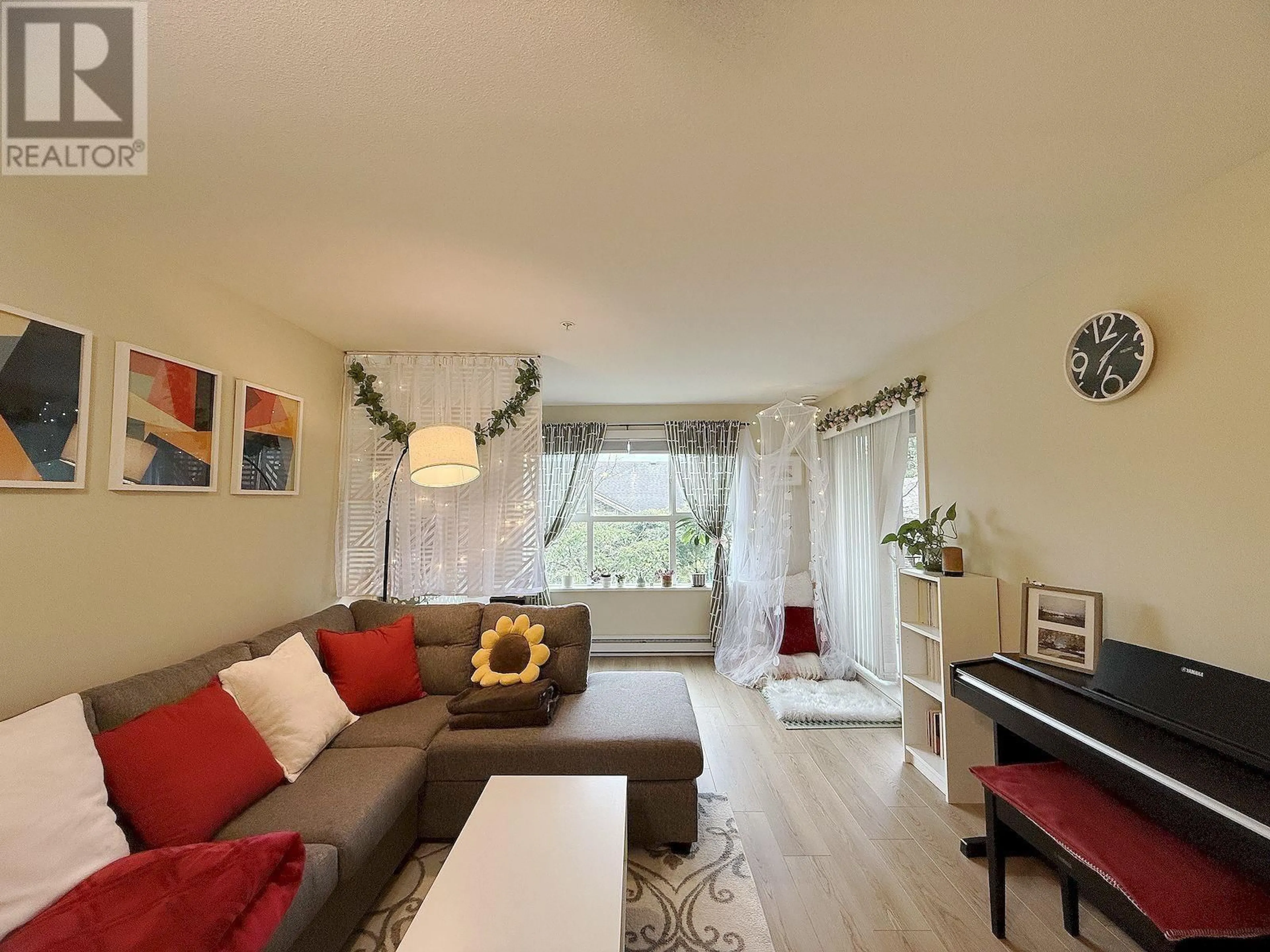 Living room with furniture, wood/laminate floor for 207 - 5775 IRMIN STREET, Burnaby British Columbia V5J0C3