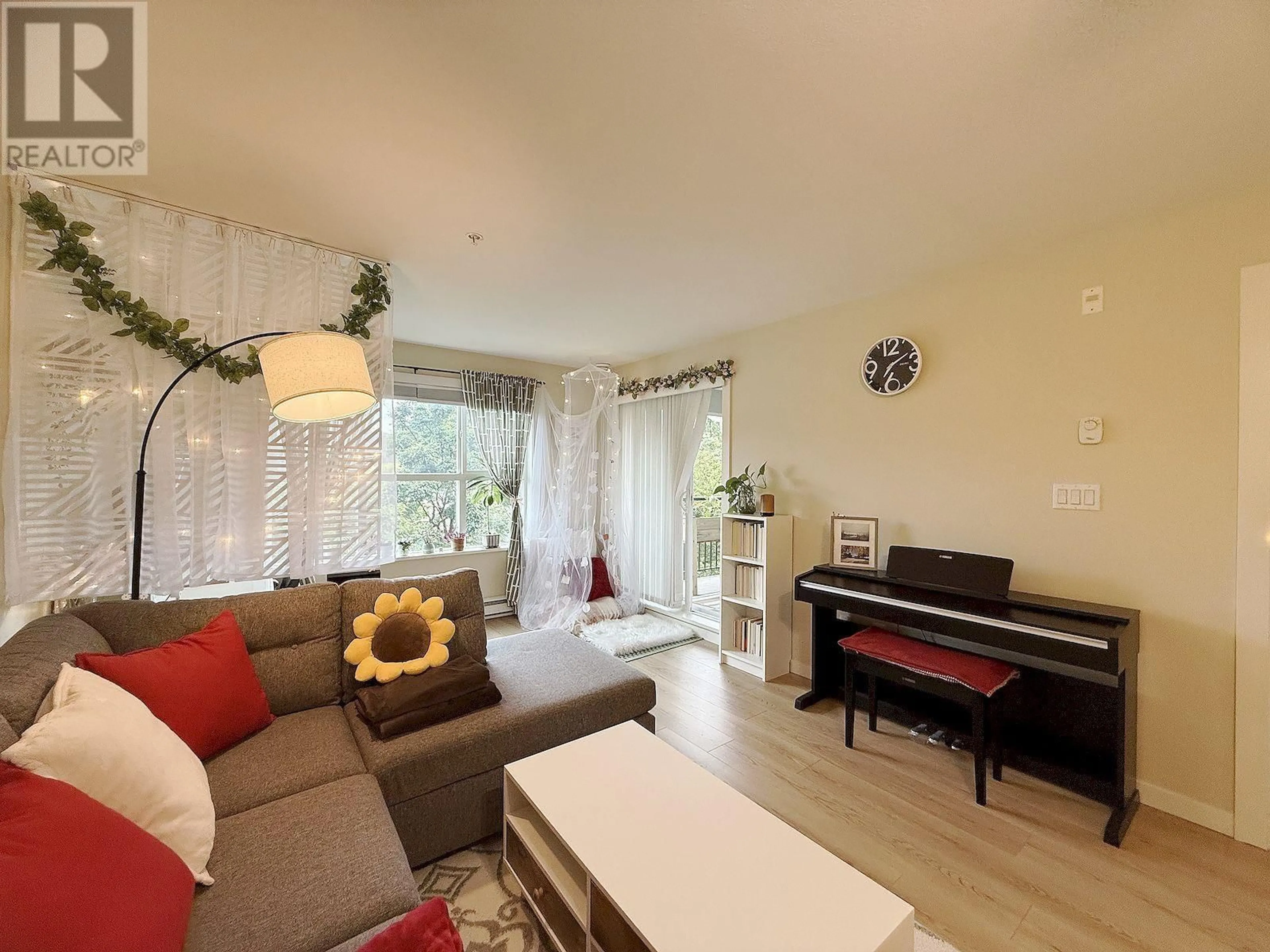 Living room with furniture, wood/laminate floor for 207 - 5775 IRMIN STREET, Burnaby British Columbia V5J0C3