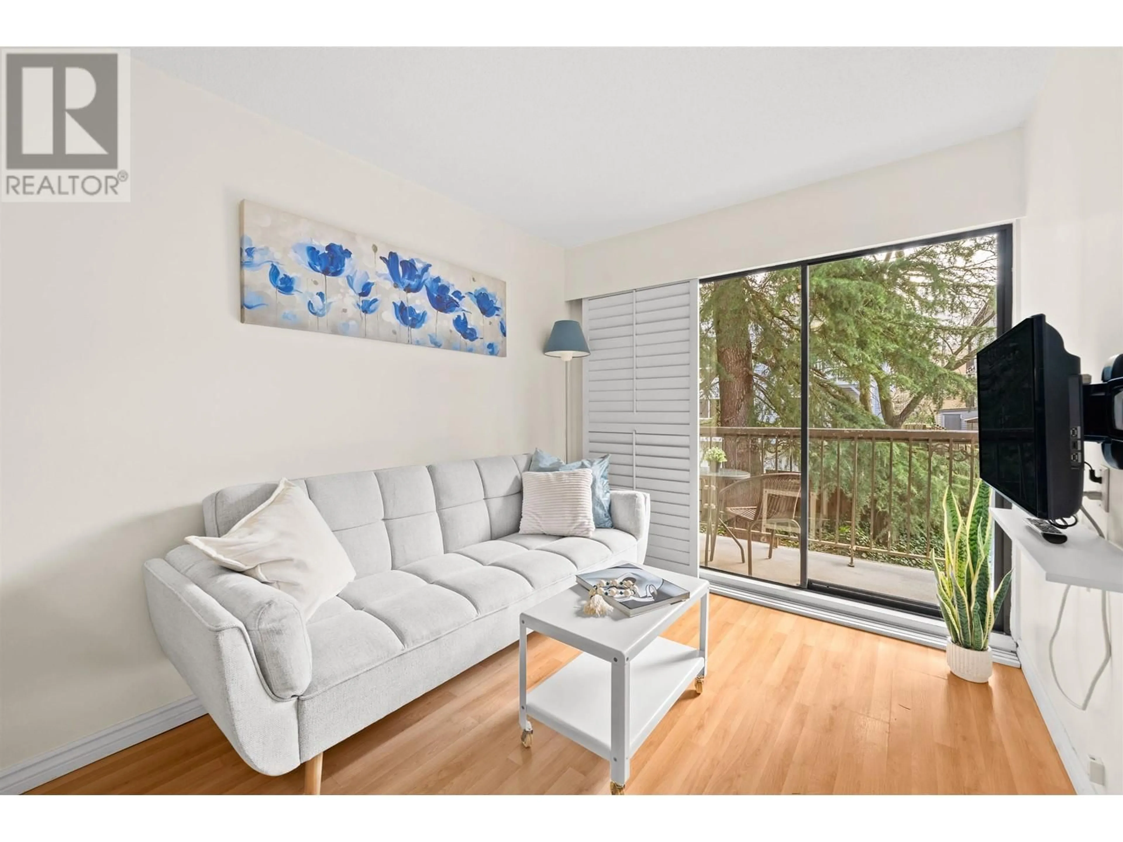 Living room with furniture, wood/laminate floor for 208 - 2330 MAPLE STREET, Vancouver British Columbia V6J3T6