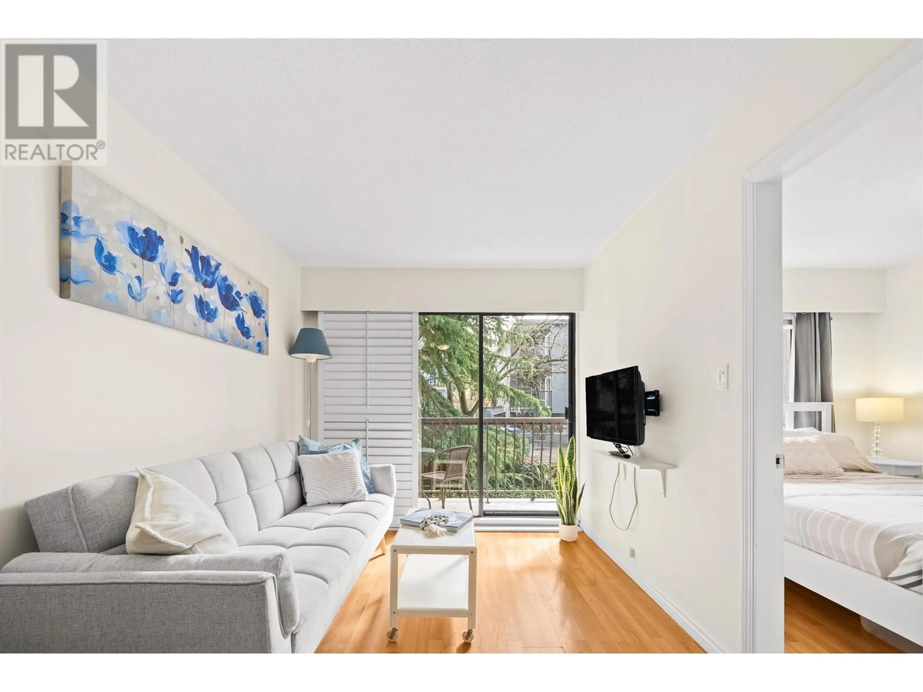 Living room with furniture, wood/laminate floor for 208 - 2330 MAPLE STREET, Vancouver British Columbia V6J3T6