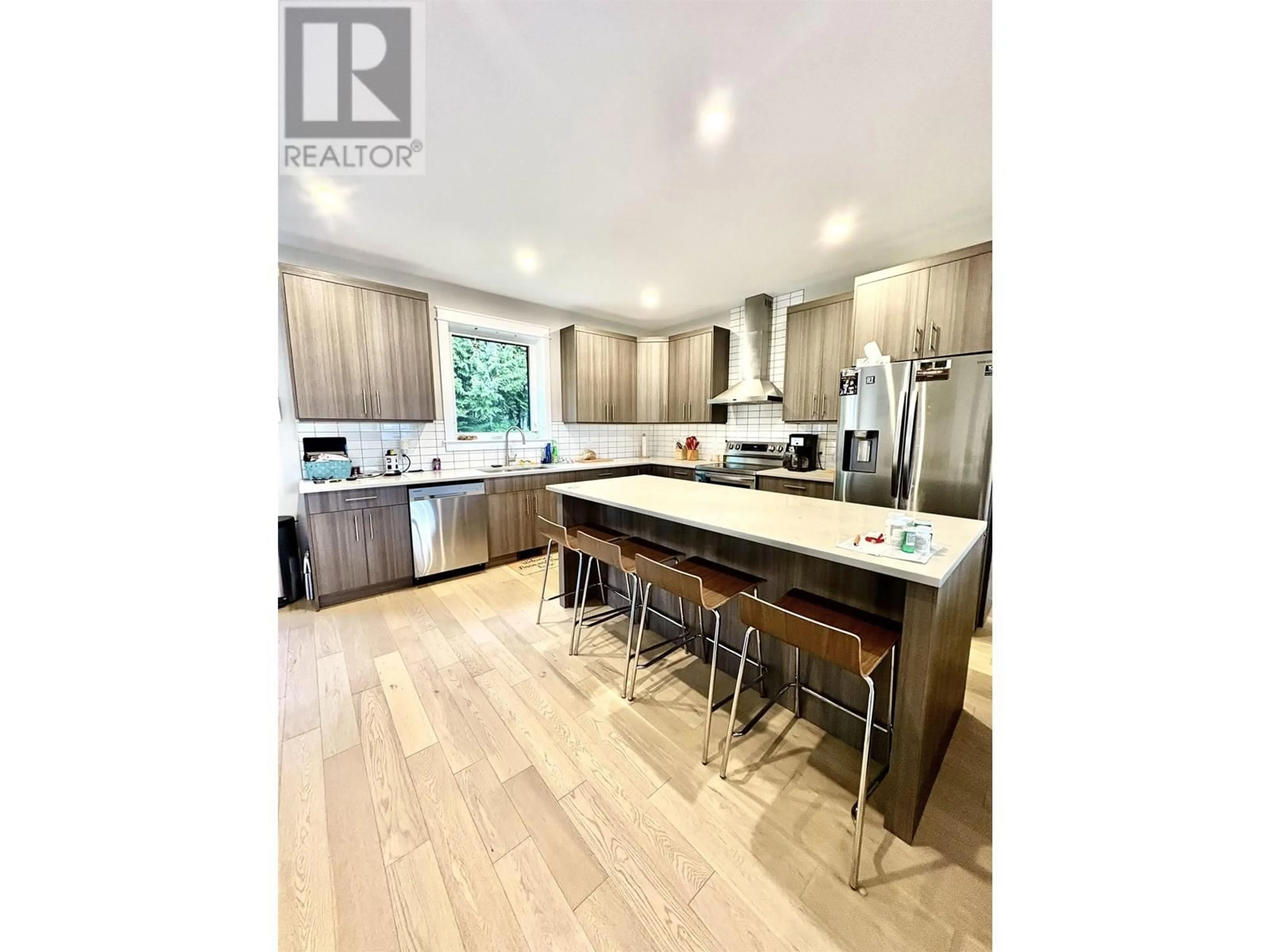 Open concept kitchen, wood/laminate floor for 49 WOZNEY STREET, Kitimat British Columbia V8C2S2
