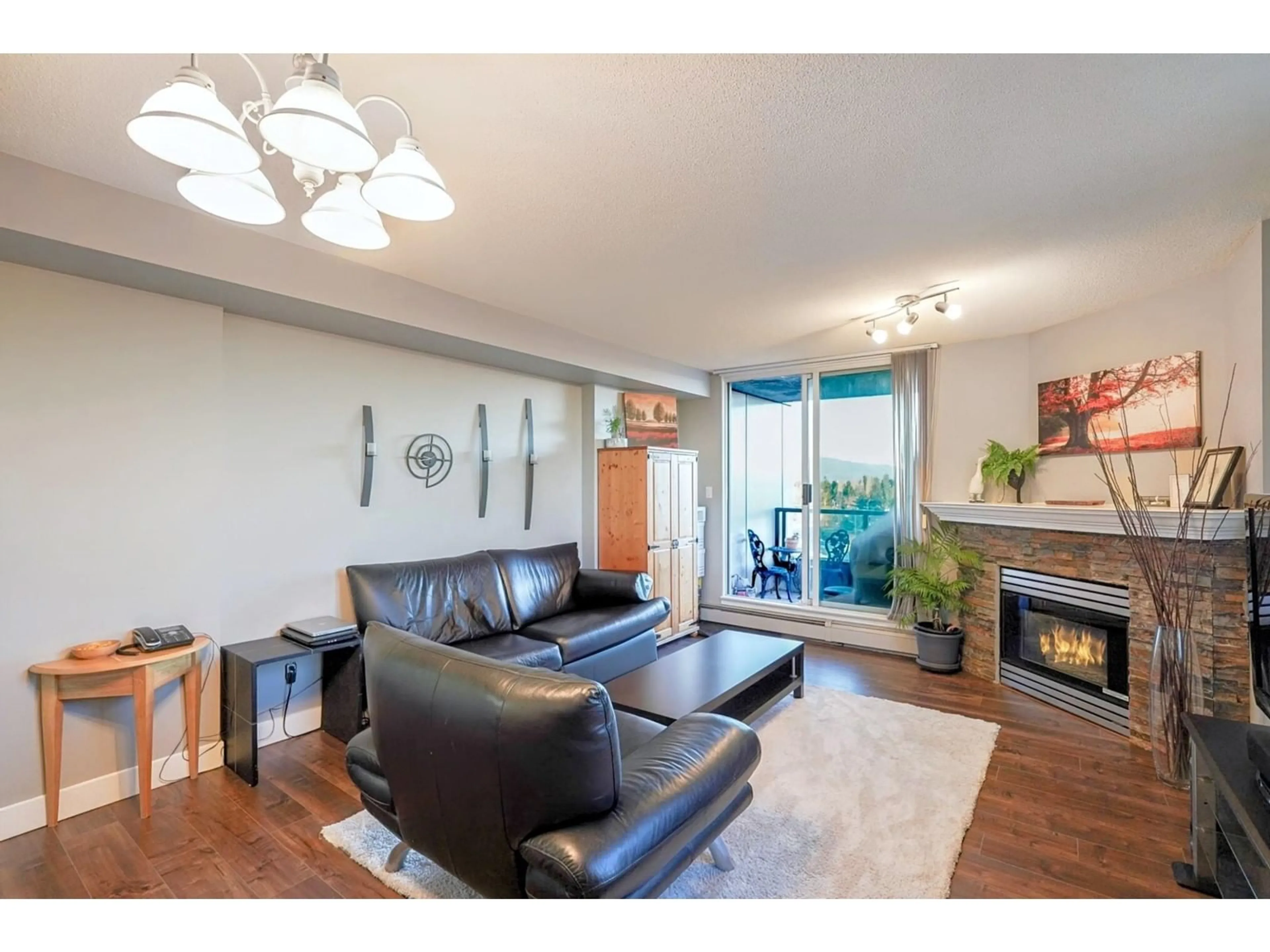 Living room with furniture, wood/laminate floor for 1106 - 13880 101, Surrey British Columbia V3T5T1
