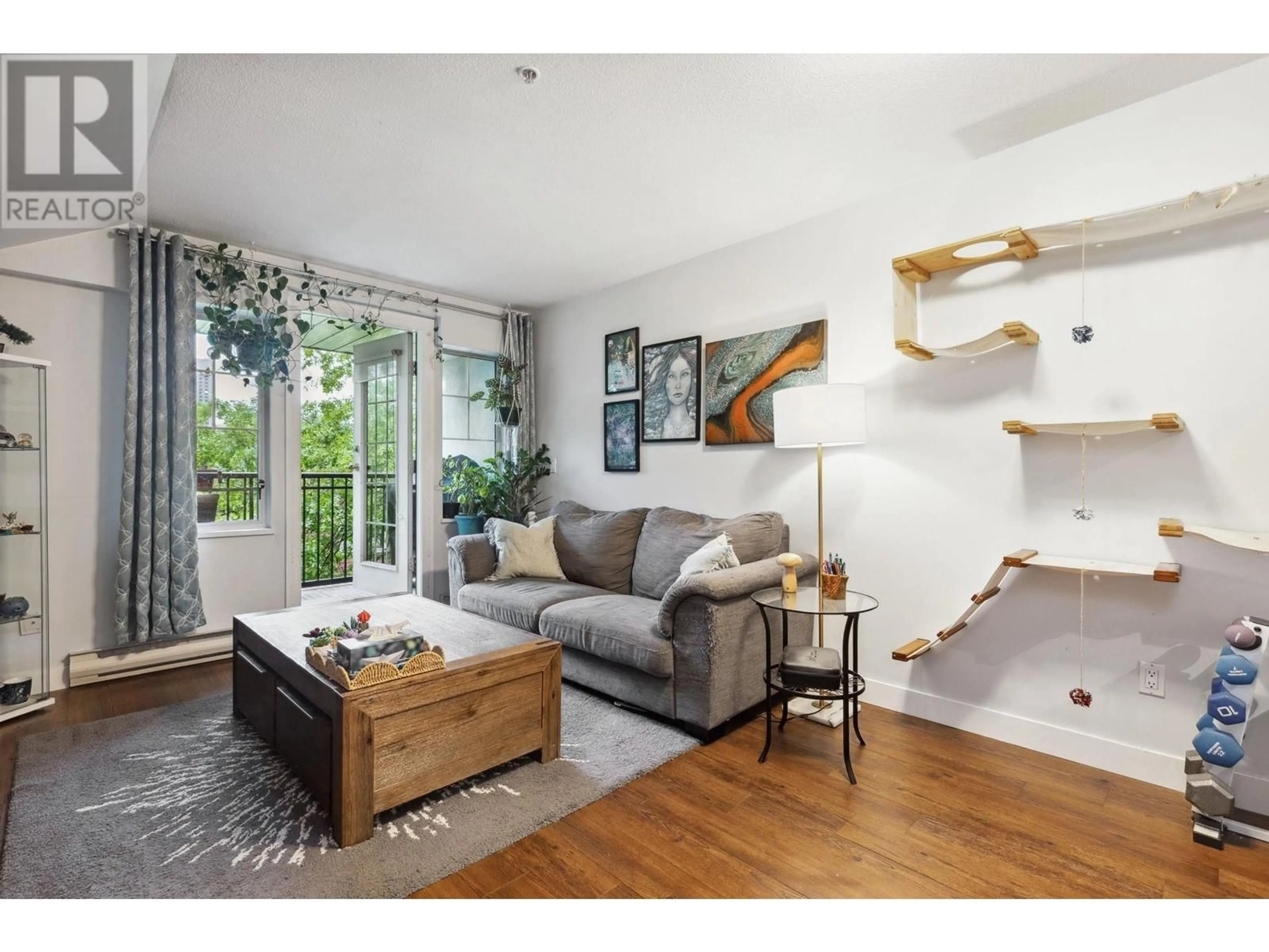 Living room with furniture, wood/laminate floor for 407 - 929 16TH AVENUE, Vancouver British Columbia V5Z1T3