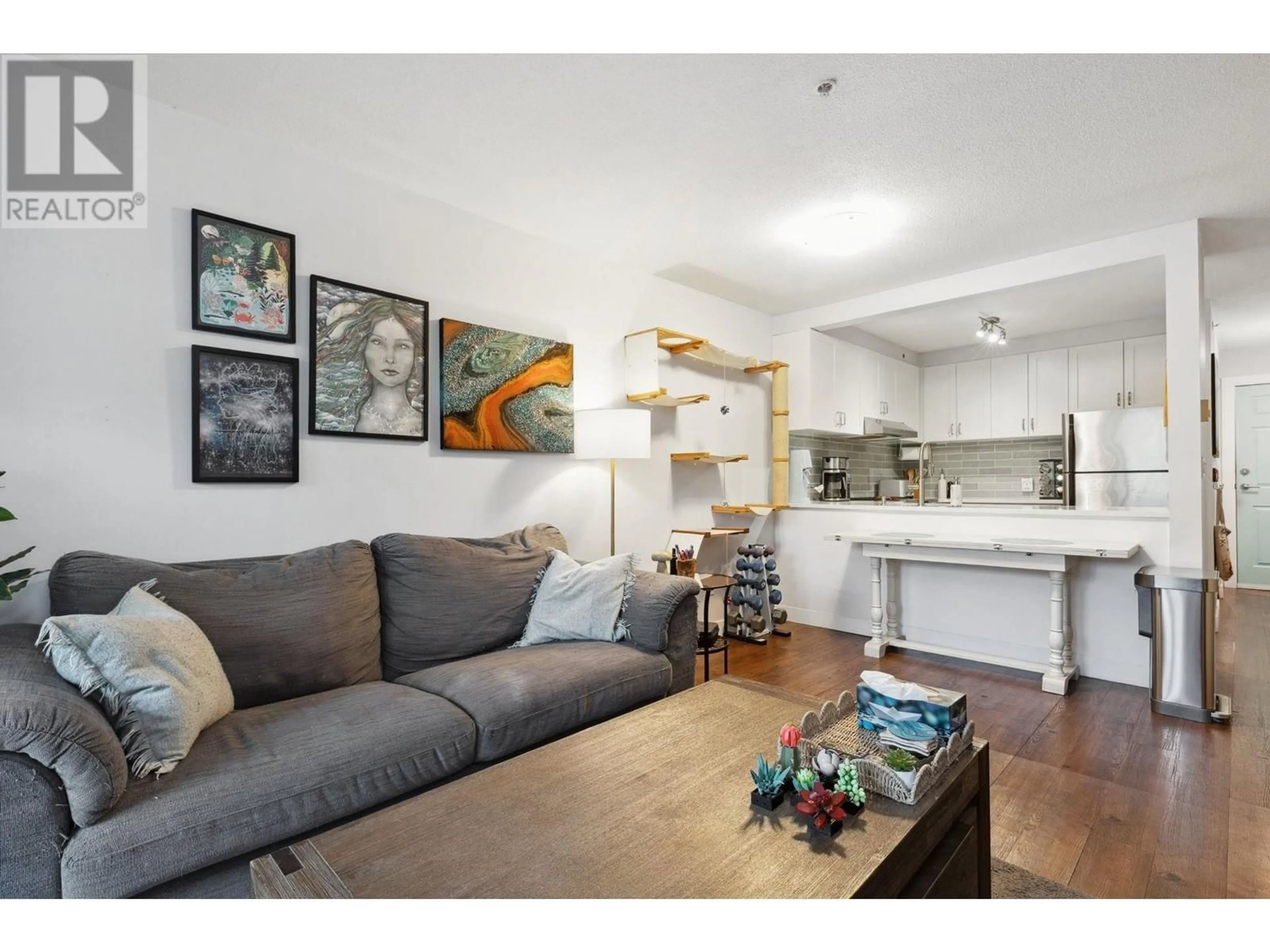 Living room with furniture, wood/laminate floor for 407 - 929 16TH AVENUE, Vancouver British Columbia V5Z1T3