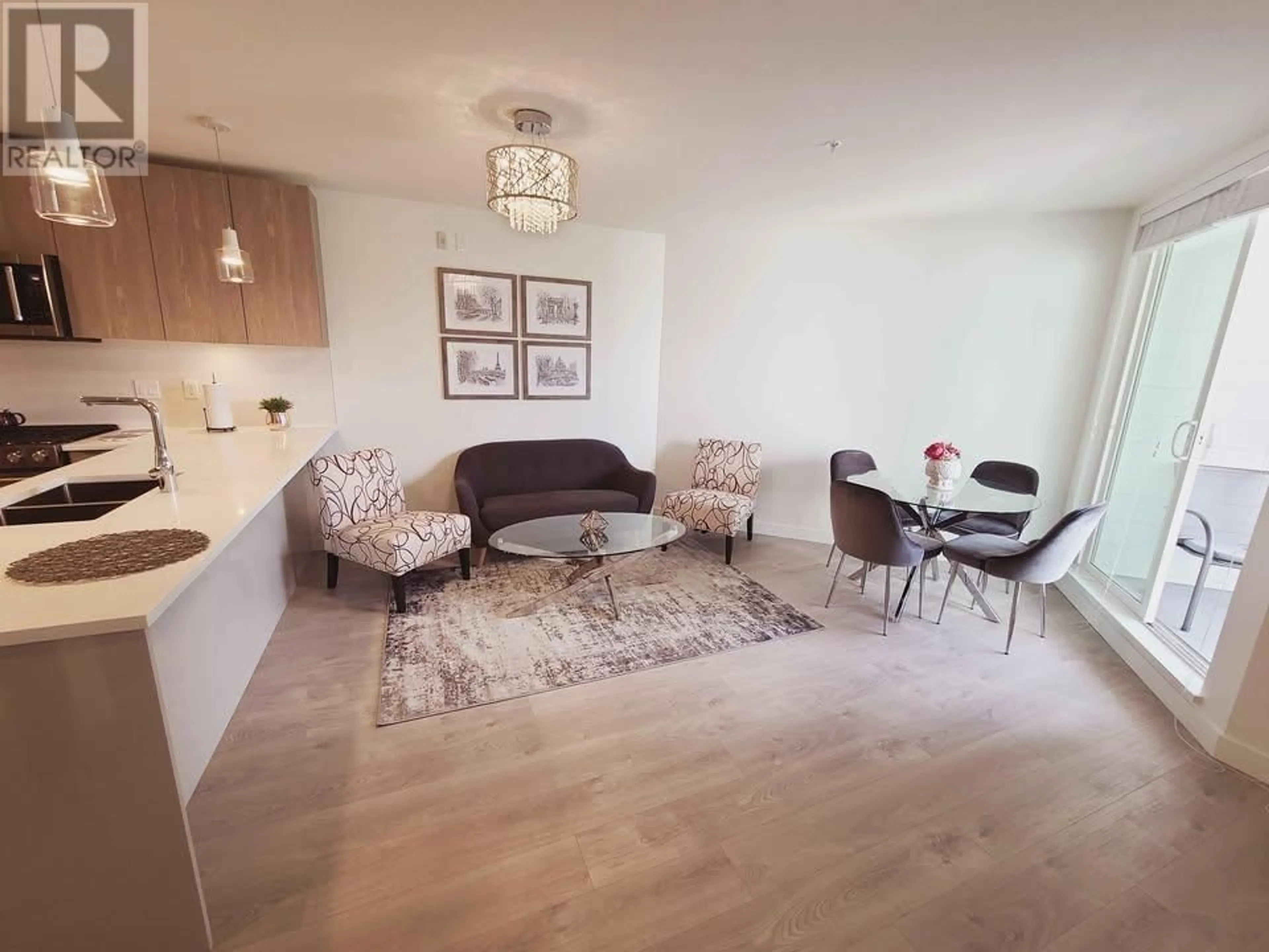 Living room with furniture, wood/laminate floor for 514 - 108 8TH STREET, North Vancouver British Columbia V7L0H1