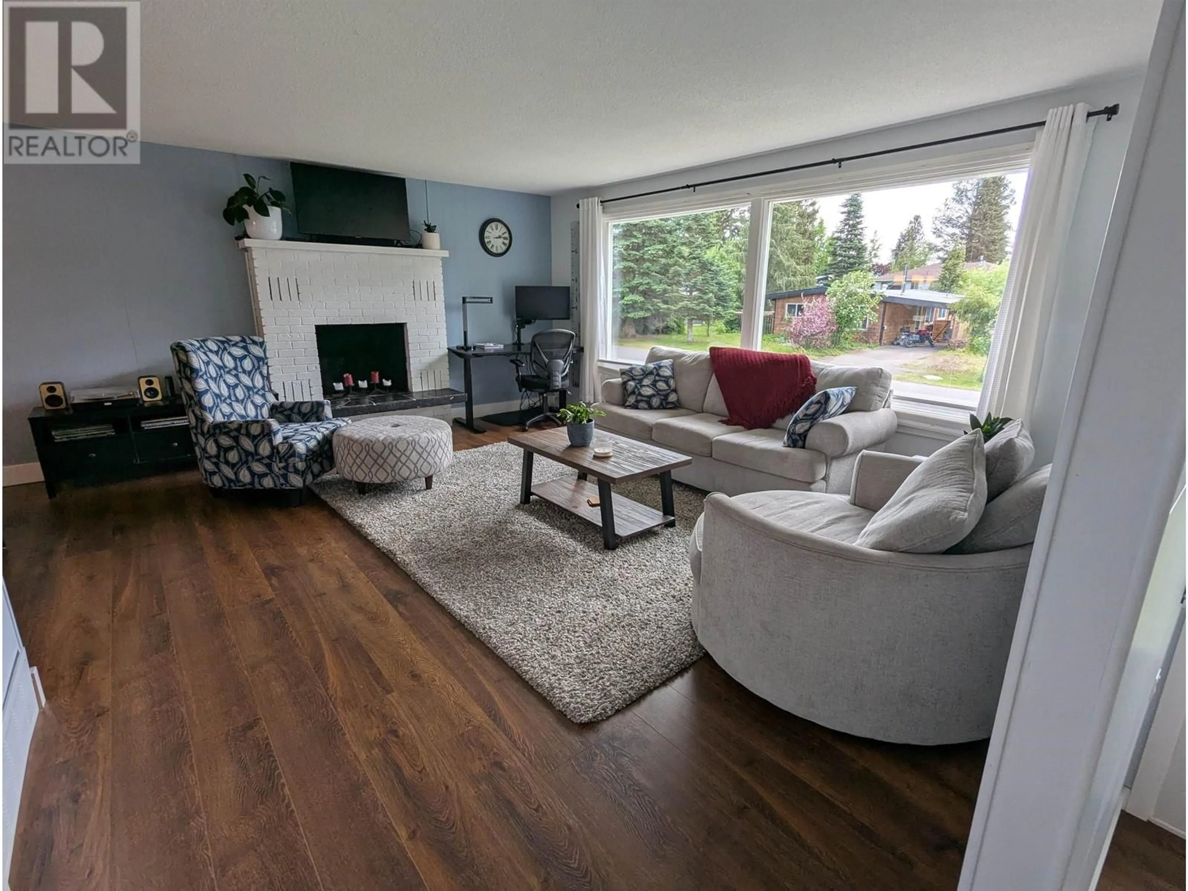 Living room with furniture, wood/laminate floor for 1389 MORICE DRIVE, Smithers British Columbia V0J2N0