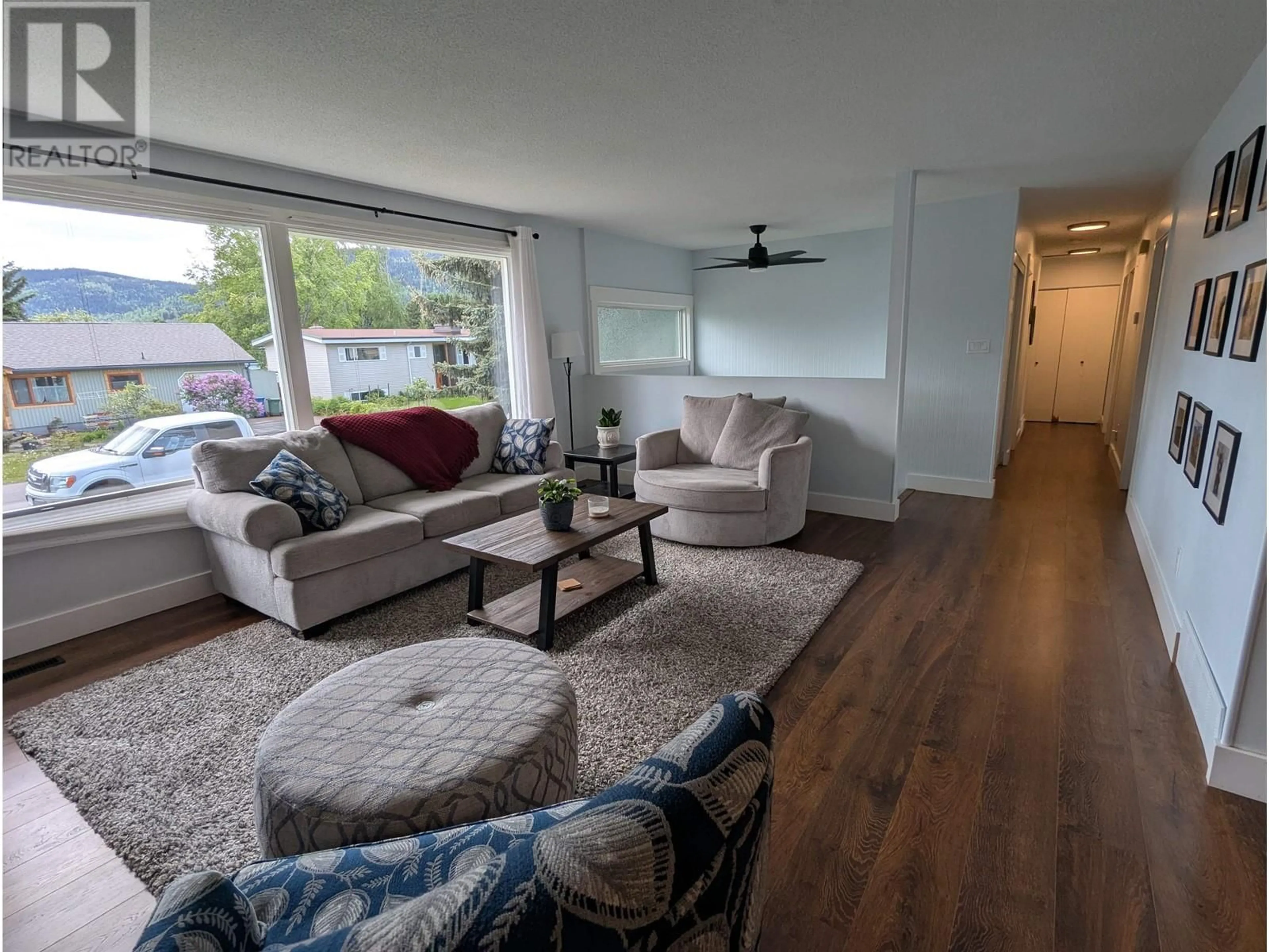 Living room with furniture, wood/laminate floor for 1389 MORICE DRIVE, Smithers British Columbia V0J2N0