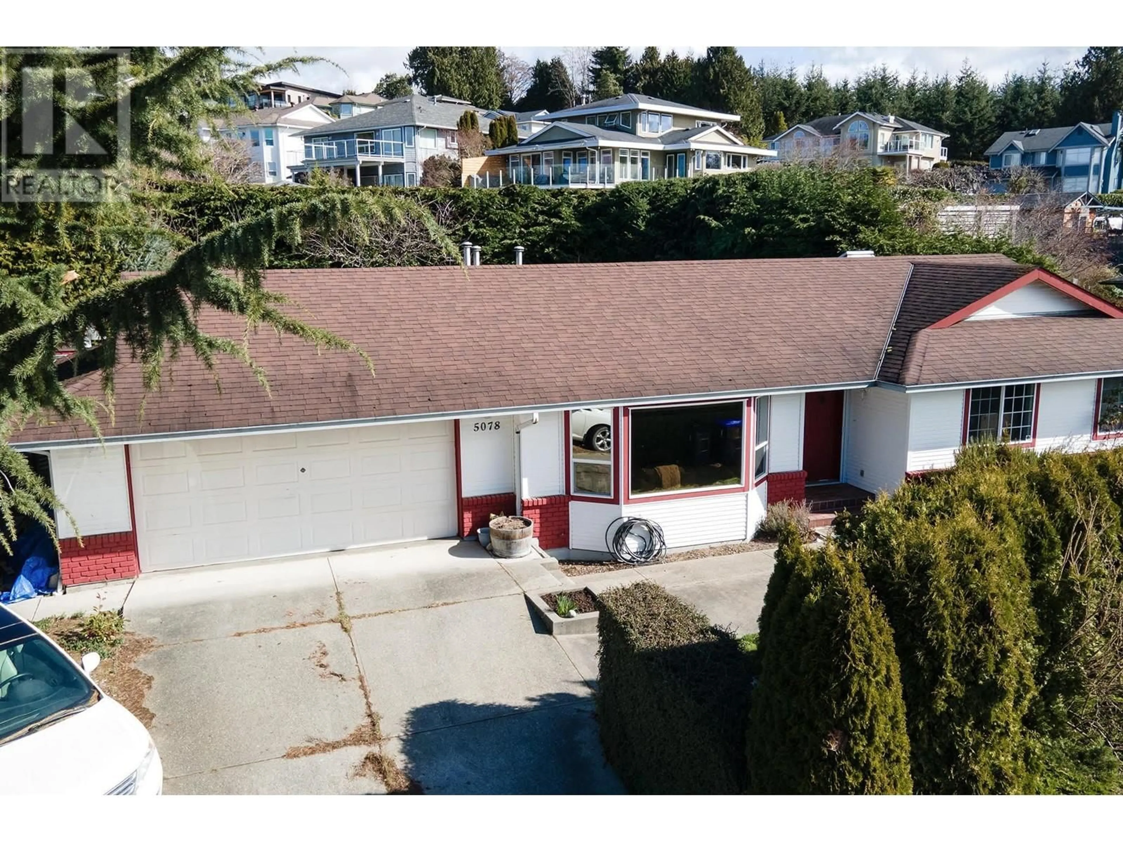 A pic from outside/outdoor area/front of a property/back of a property/a pic from drone, street for 5078 BAY ROAD, Sechelt British Columbia V7Z0E9