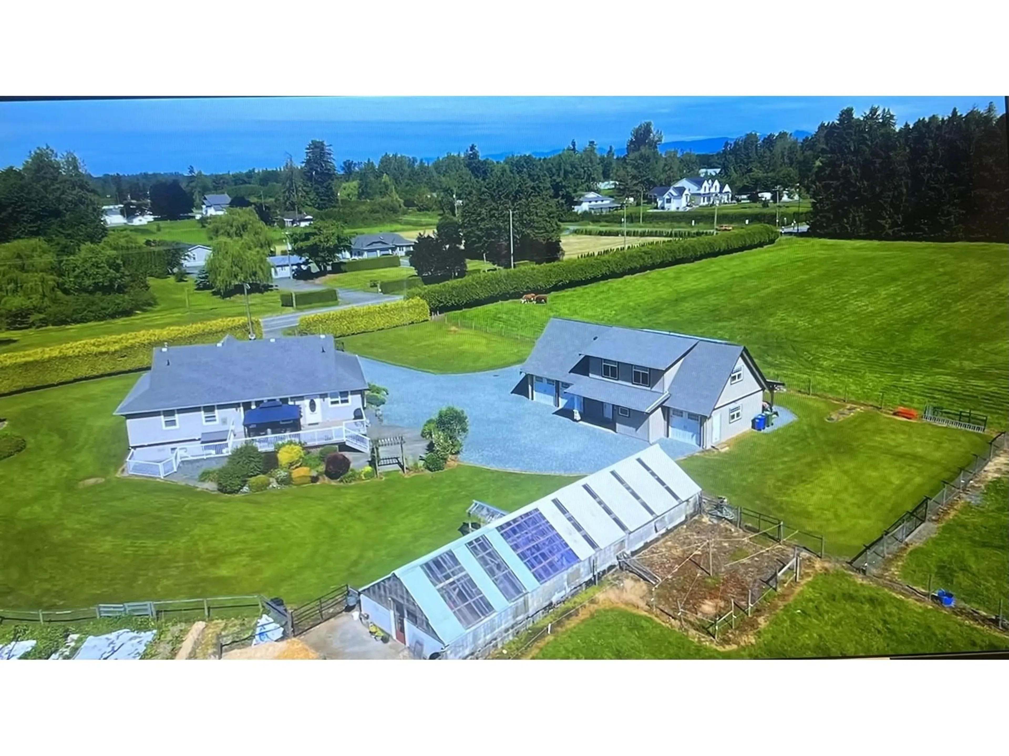 A pic from outside/outdoor area/front of a property/back of a property/a pic from drone, water/lake/river/ocean view for 5728 BRADNER, Abbotsford British Columbia V4X2P1