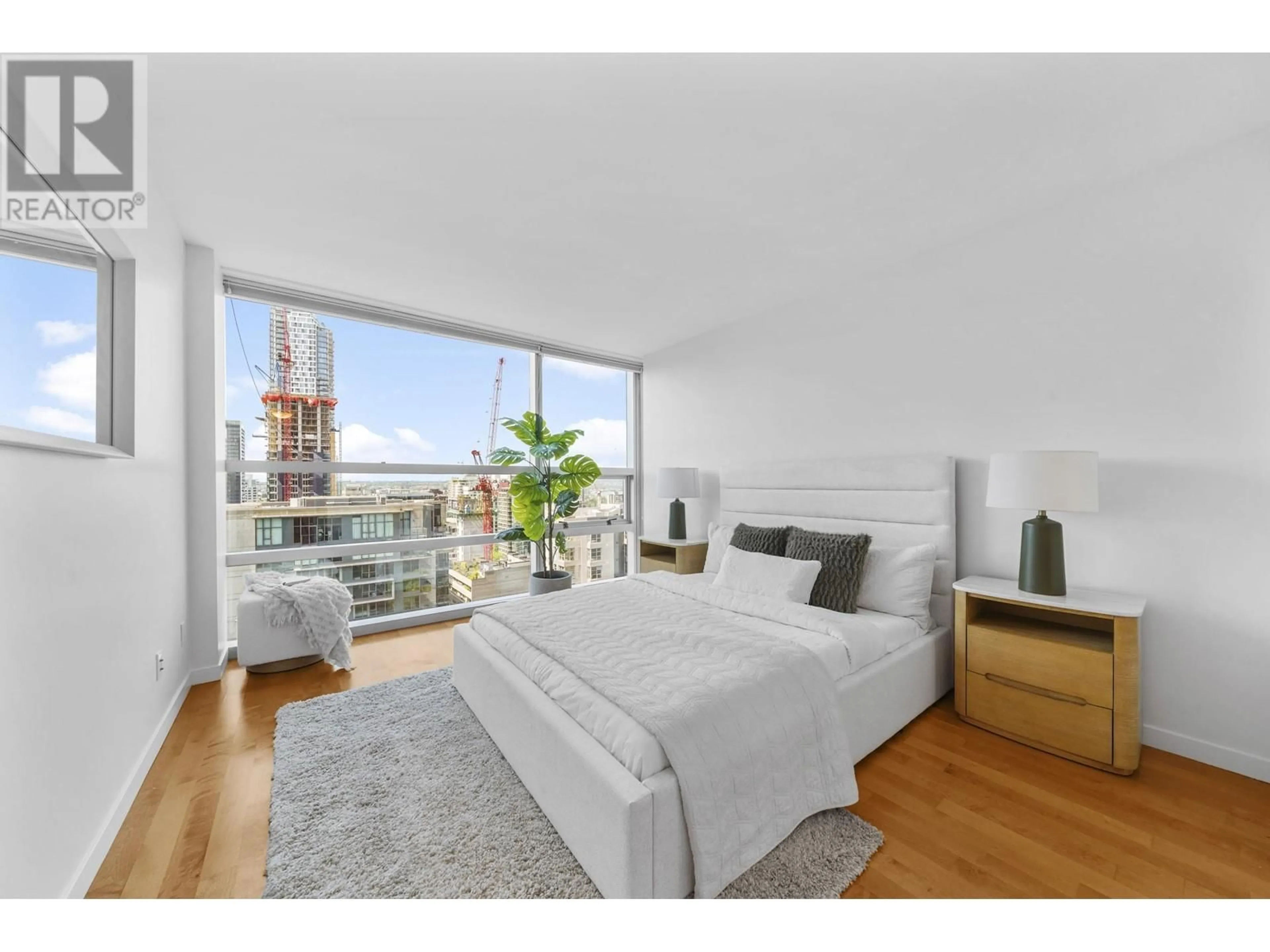 Bedroom with bed, wood/laminate floor for 2201 - 1050 BURRARD STREET, Vancouver British Columbia V6Z2S3