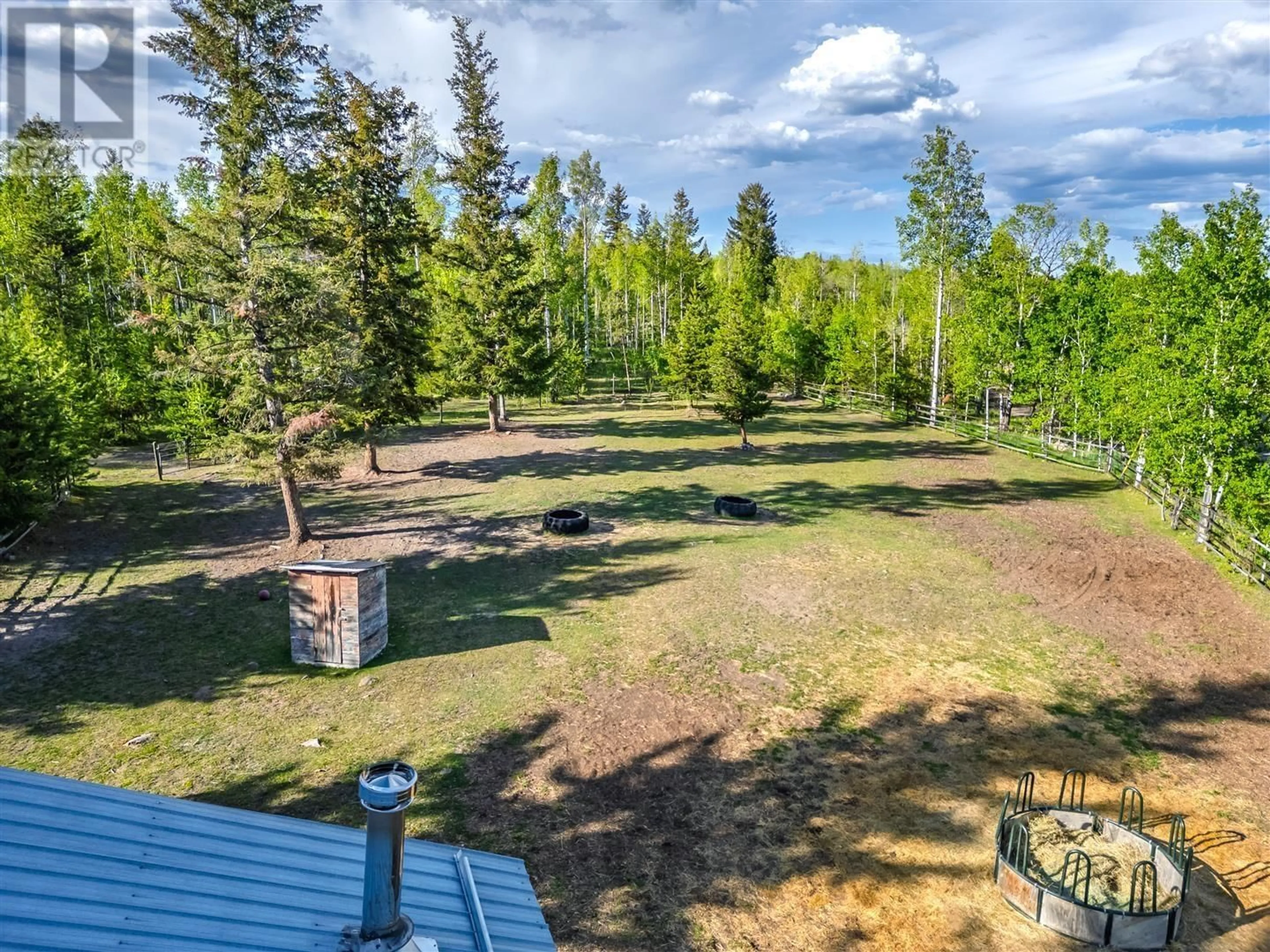 A pic from outside/outdoor area/front of a property/back of a property/a pic from drone, forest/trees view for 5834 GREEN LAKE NORTH ROAD, 70 Mile House British Columbia V0K2K1