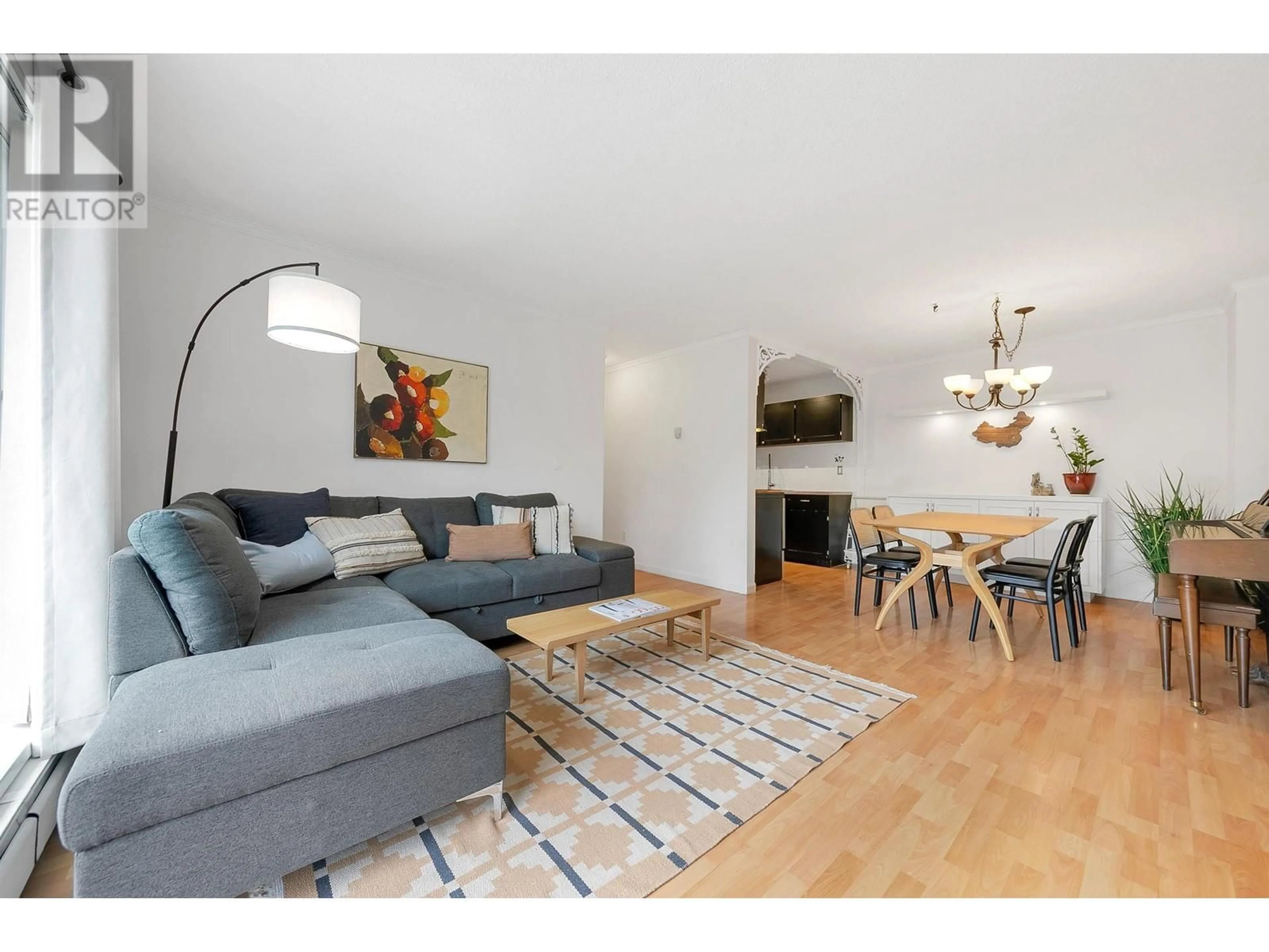 Living room with furniture, wood/laminate floor for 301 - 809 16TH STREET, North Vancouver British Columbia V7P1R2