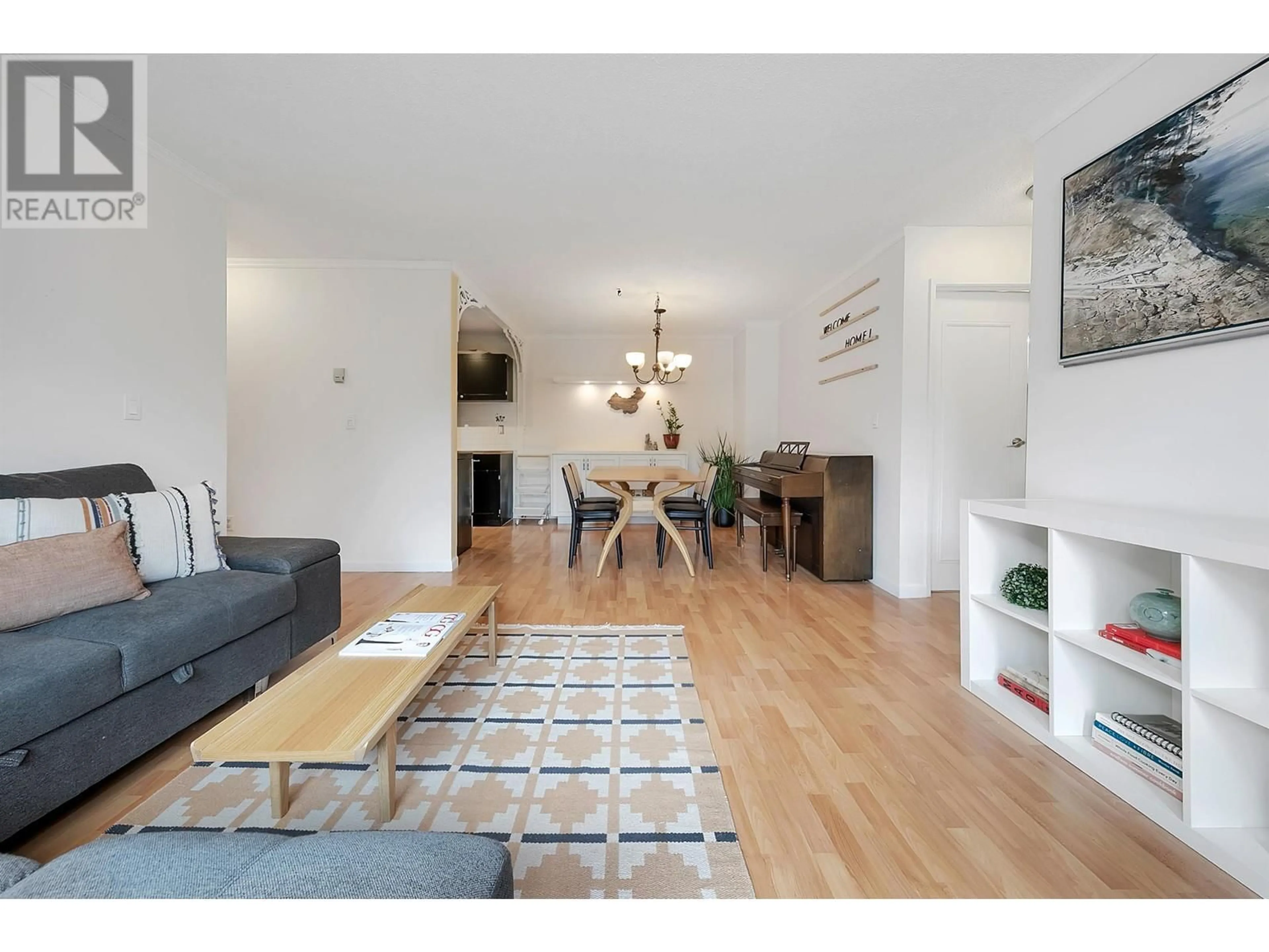 Living room with furniture, wood/laminate floor for 301 - 809 16TH STREET, North Vancouver British Columbia V7P1R2