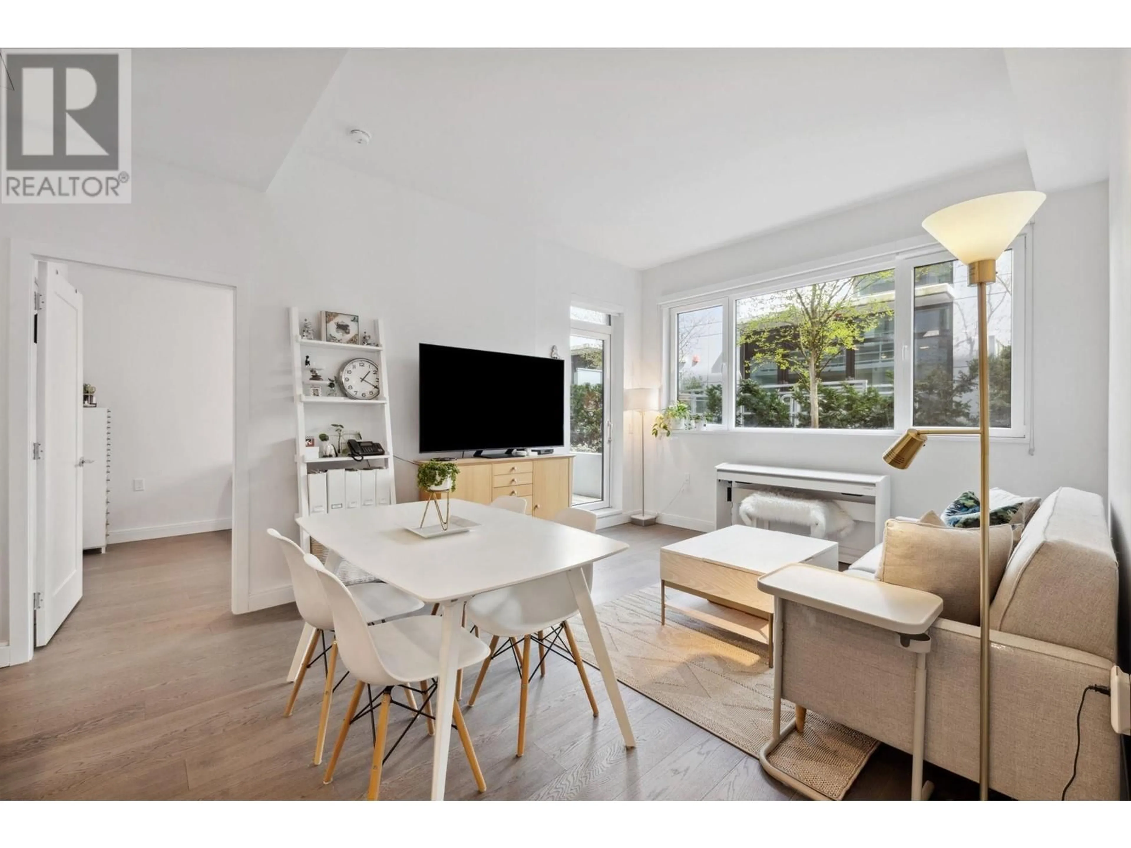 Living room with furniture, wood/laminate floor for 103 - 4932 CAMBIE STREET, Vancouver British Columbia V5Z0K1