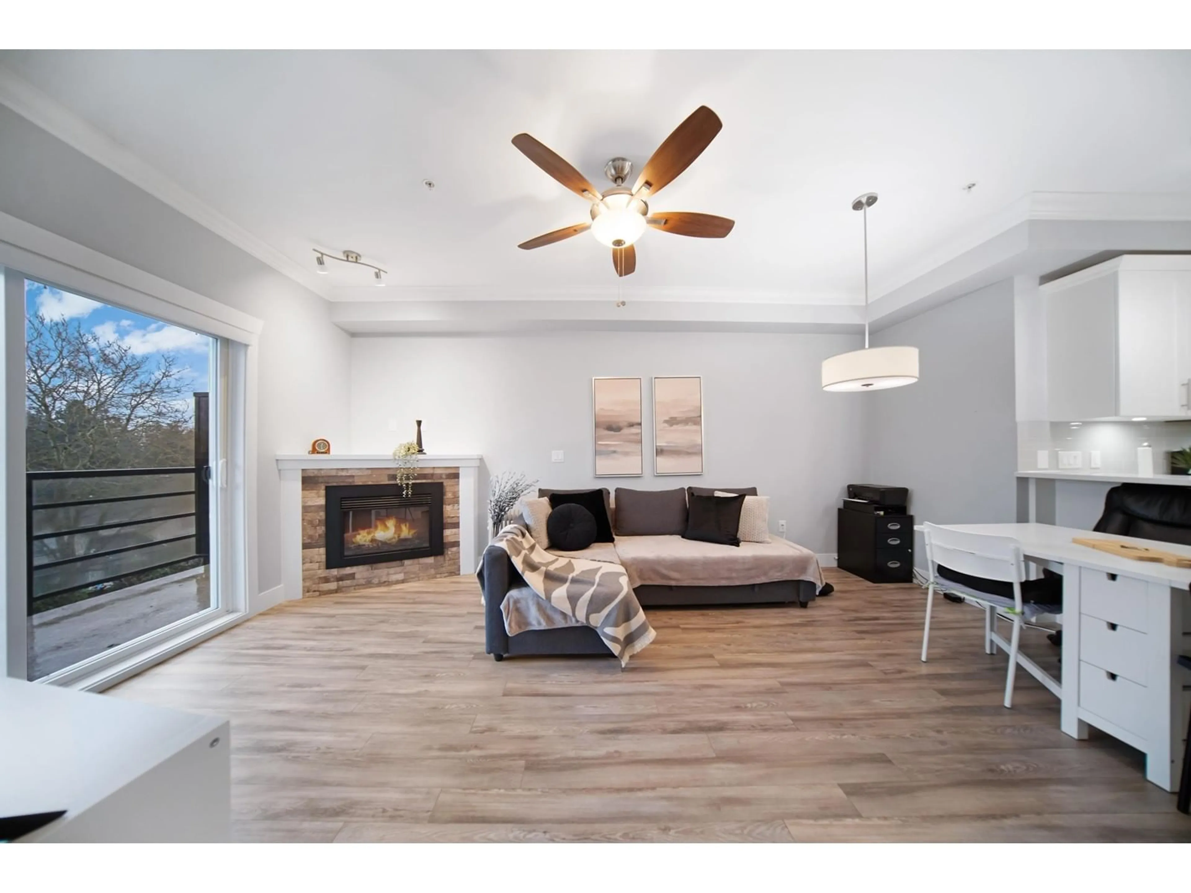 Living room with furniture, wood/laminate floor for 403 - 8183 121A, Surrey British Columbia V3W1S7