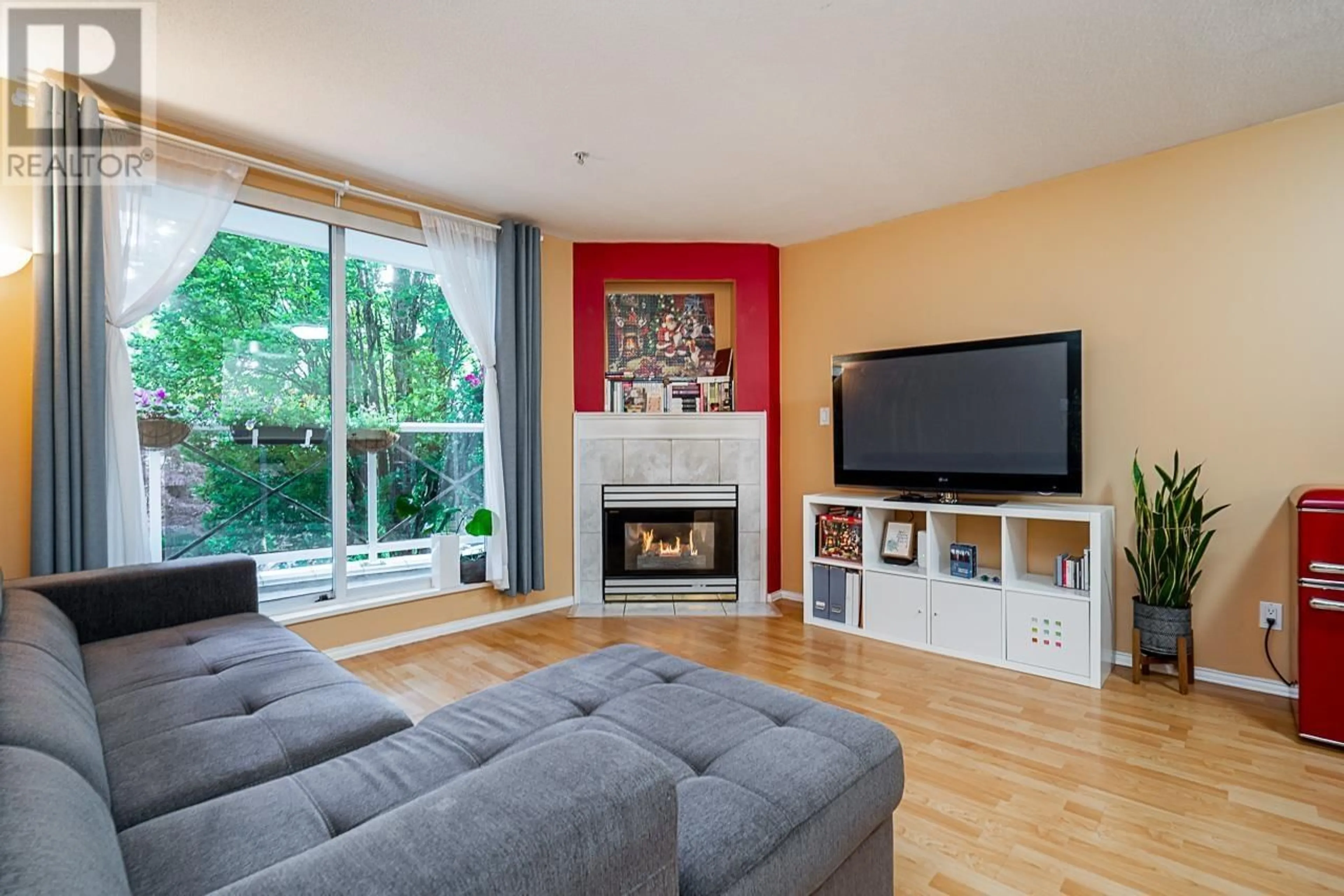 Living room with furniture, wood/laminate floor for 211 - 2485 ATKINS AVENUE, Port Coquitlam British Columbia V3C1Z1