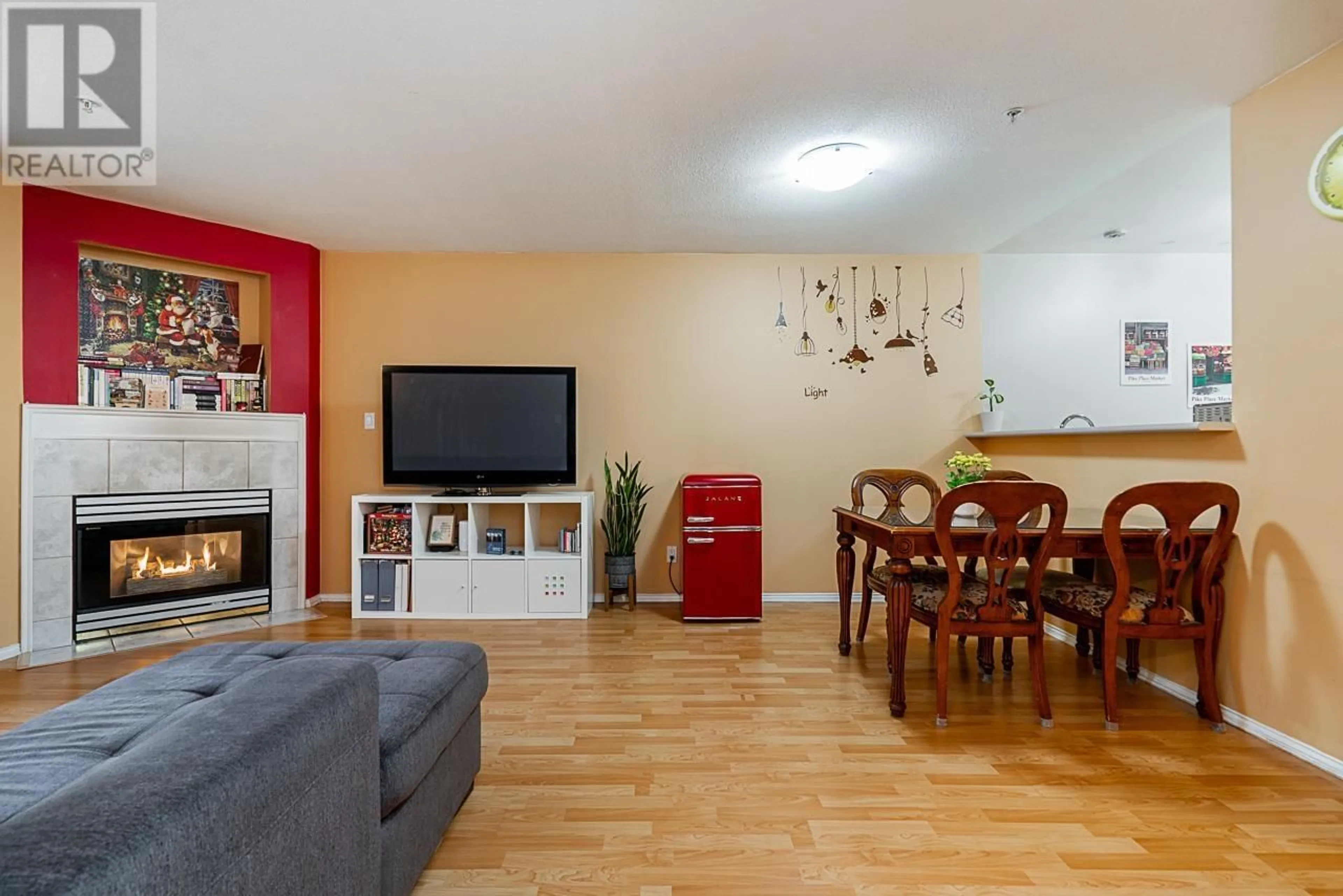 Living room with furniture, wood/laminate floor for 211 - 2485 ATKINS AVENUE, Port Coquitlam British Columbia V3C1Z1