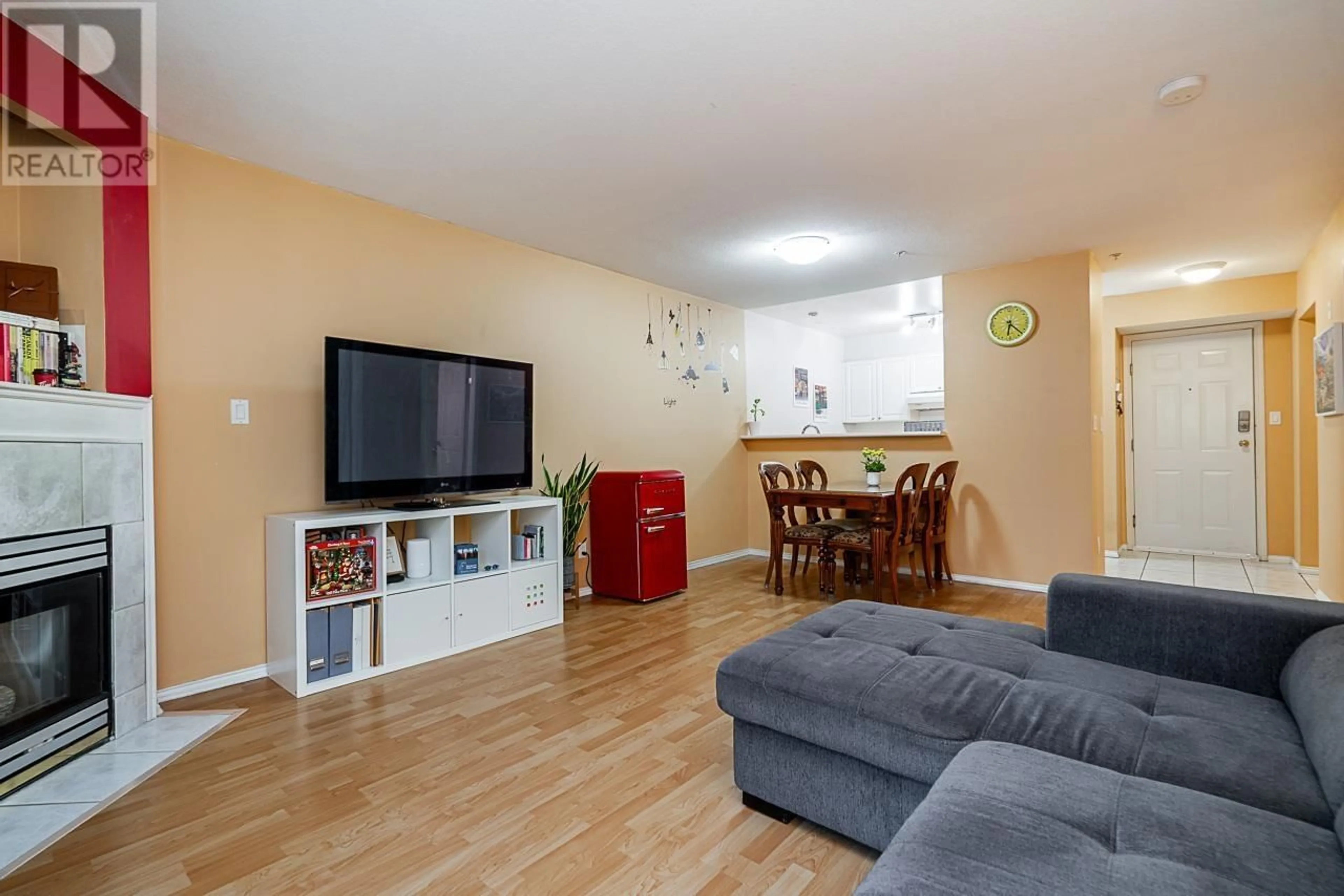 Living room with furniture, wood/laminate floor for 211 - 2485 ATKINS AVENUE, Port Coquitlam British Columbia V3C1Z1