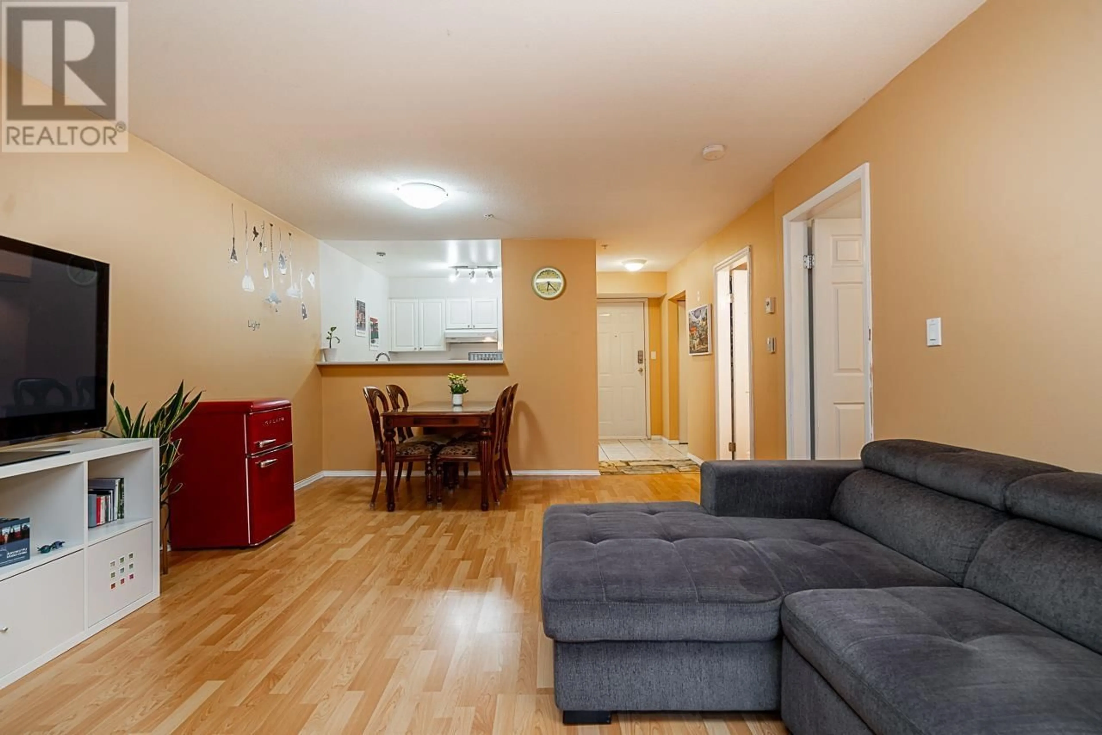 Living room with furniture, wood/laminate floor for 211 - 2485 ATKINS AVENUE, Port Coquitlam British Columbia V3C1Z1