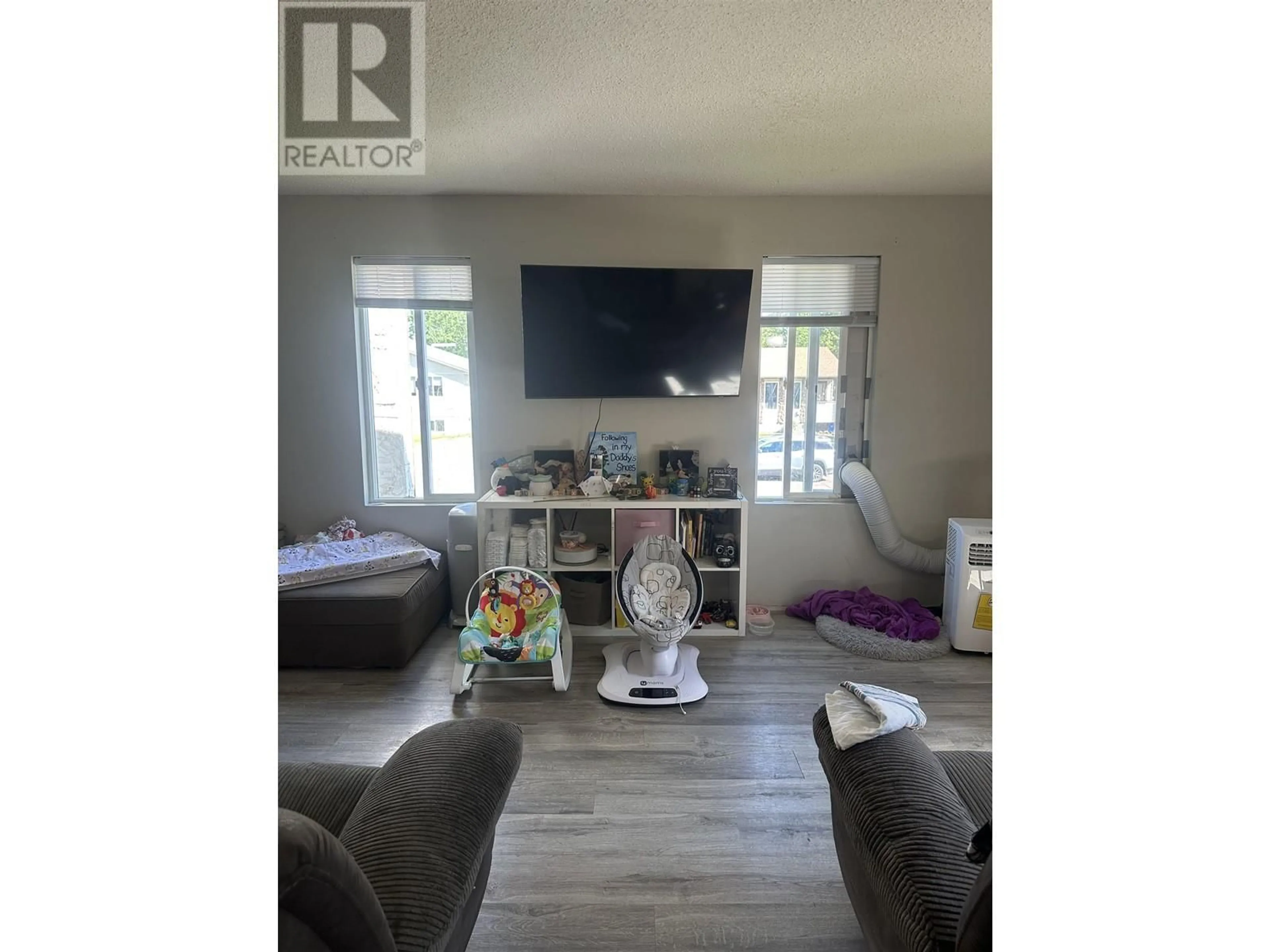 Living room with furniture, wood/laminate floor for 7861 ROCHESTER CRESCENT, Prince George British Columbia V2N3V7