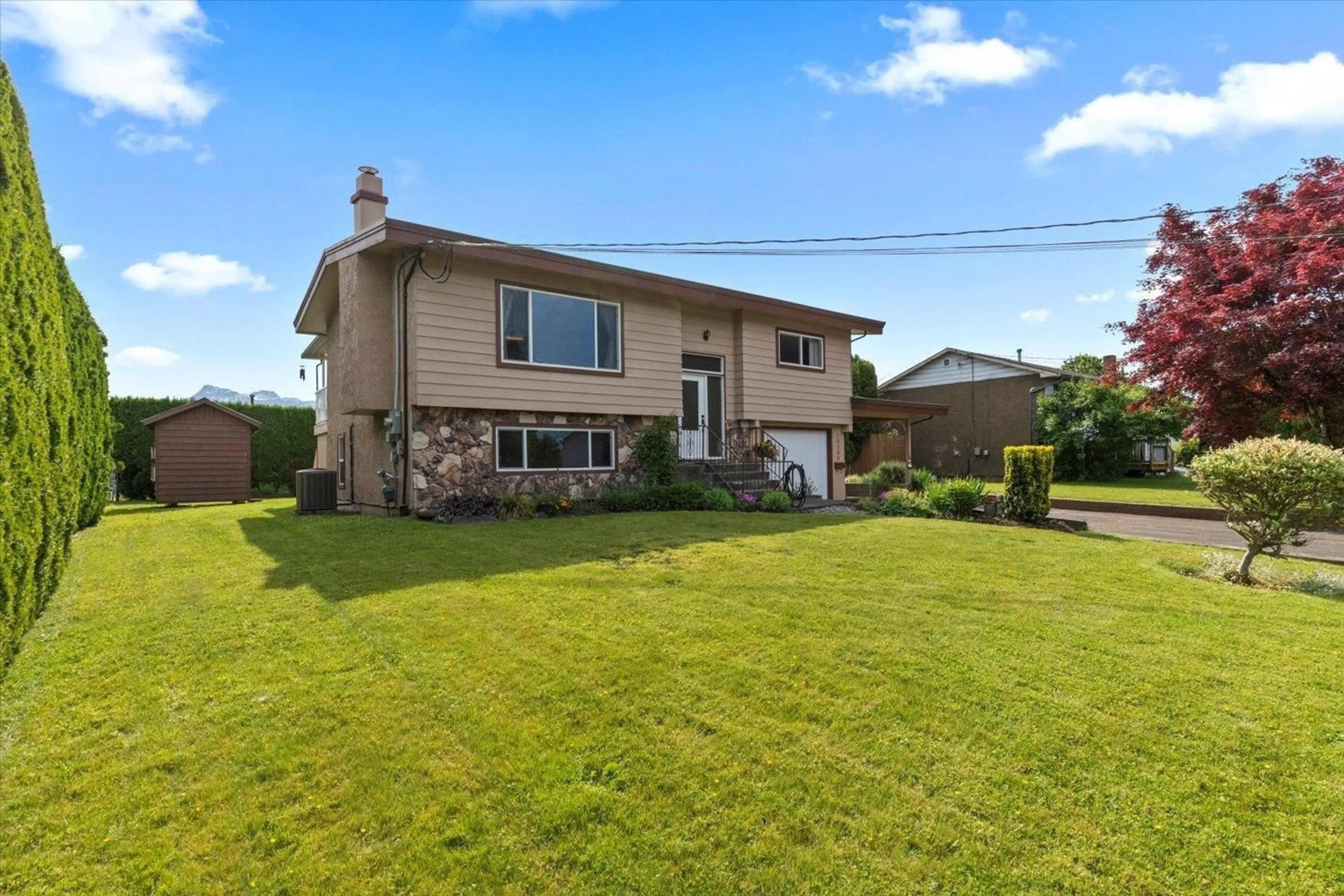 A pic from outside/outdoor area/front of a property/back of a property/a pic from drone, street for 10596 CONRAD STREET, Chilliwack British Columbia V2P6S3