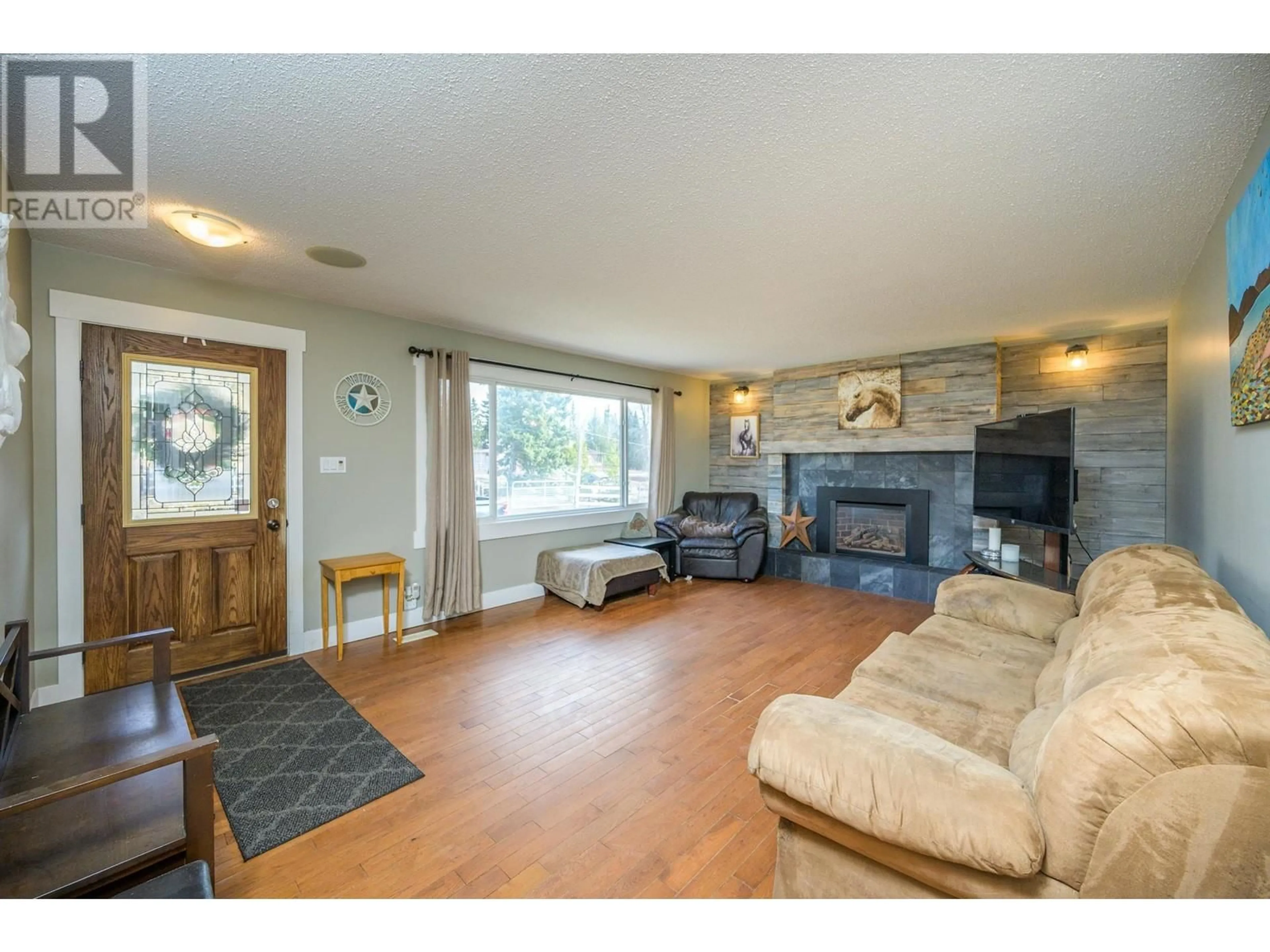 Living room with furniture, wood/laminate floor for 5503 CRANBROOK HILL ROAD, Prince George British Columbia V2M7C8