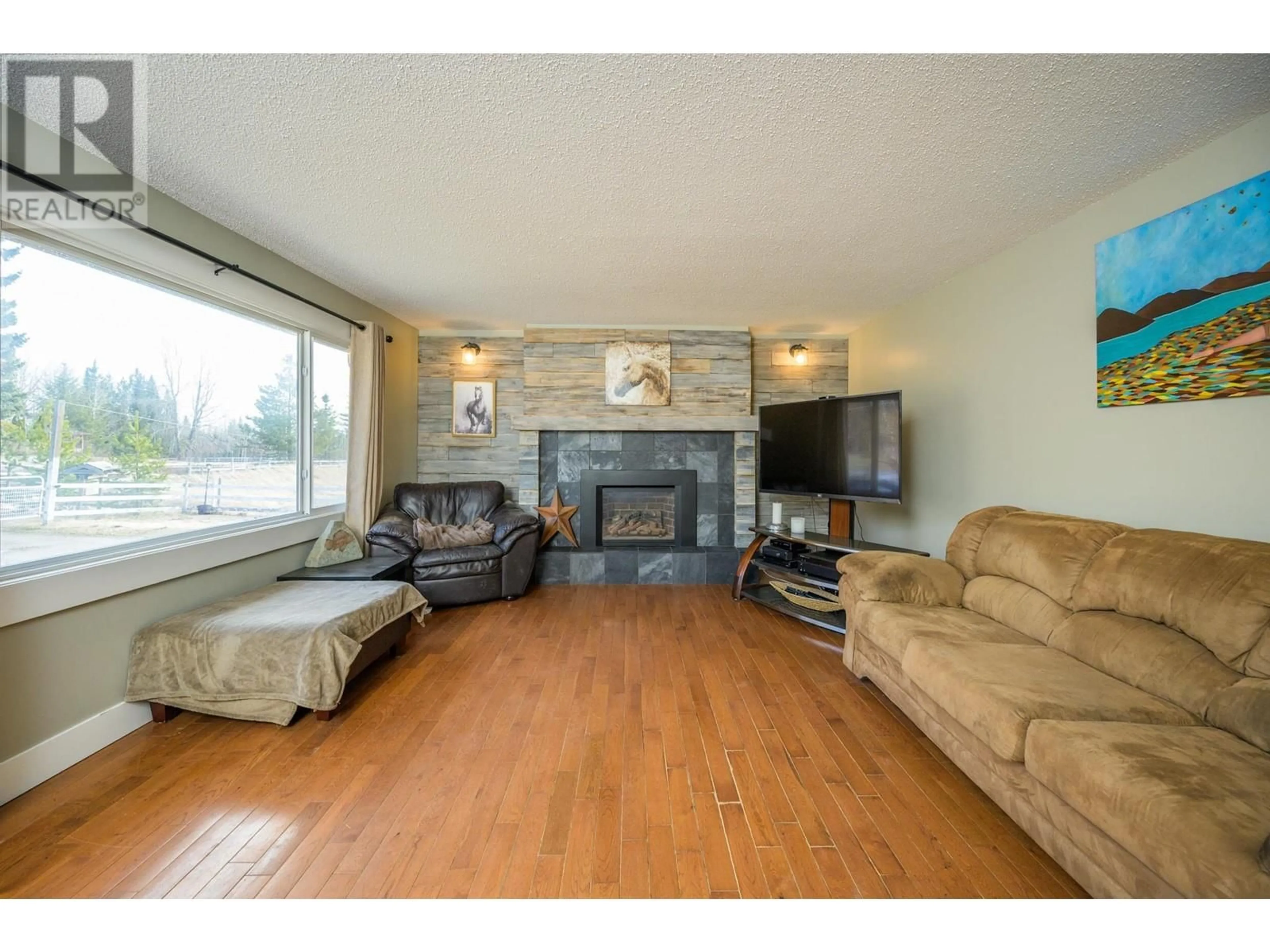 Living room with furniture, wood/laminate floor for 5503 CRANBROOK HILL ROAD, Prince George British Columbia V2M7C8