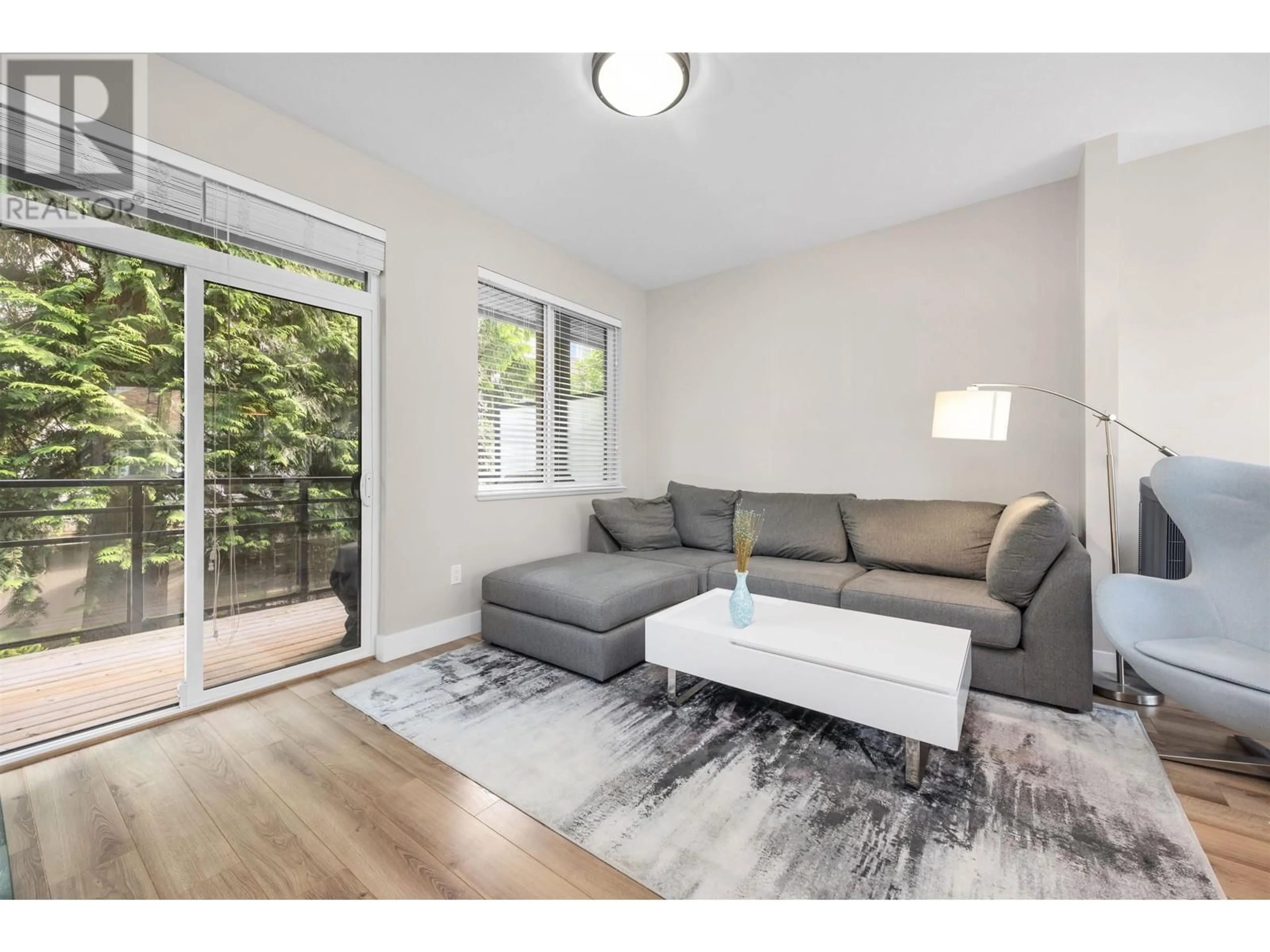 Living room with furniture, wood/laminate floor for 4 - 7180 GILBERT ROAD, Richmond British Columbia V7C3W2