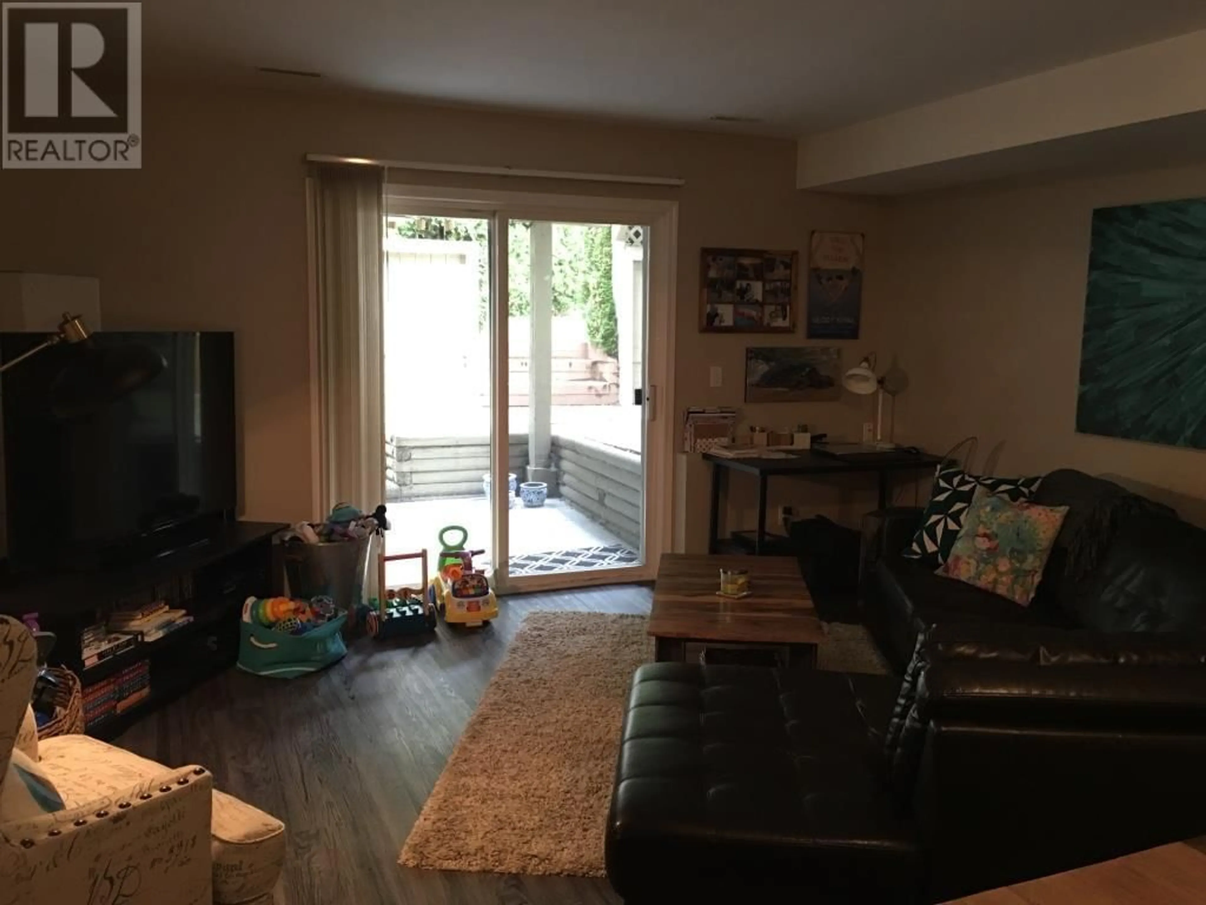 Living room with furniture, wood/laminate floor for 1907 HARBOUR STREET, Port Coquitlam British Columbia V3C1A4