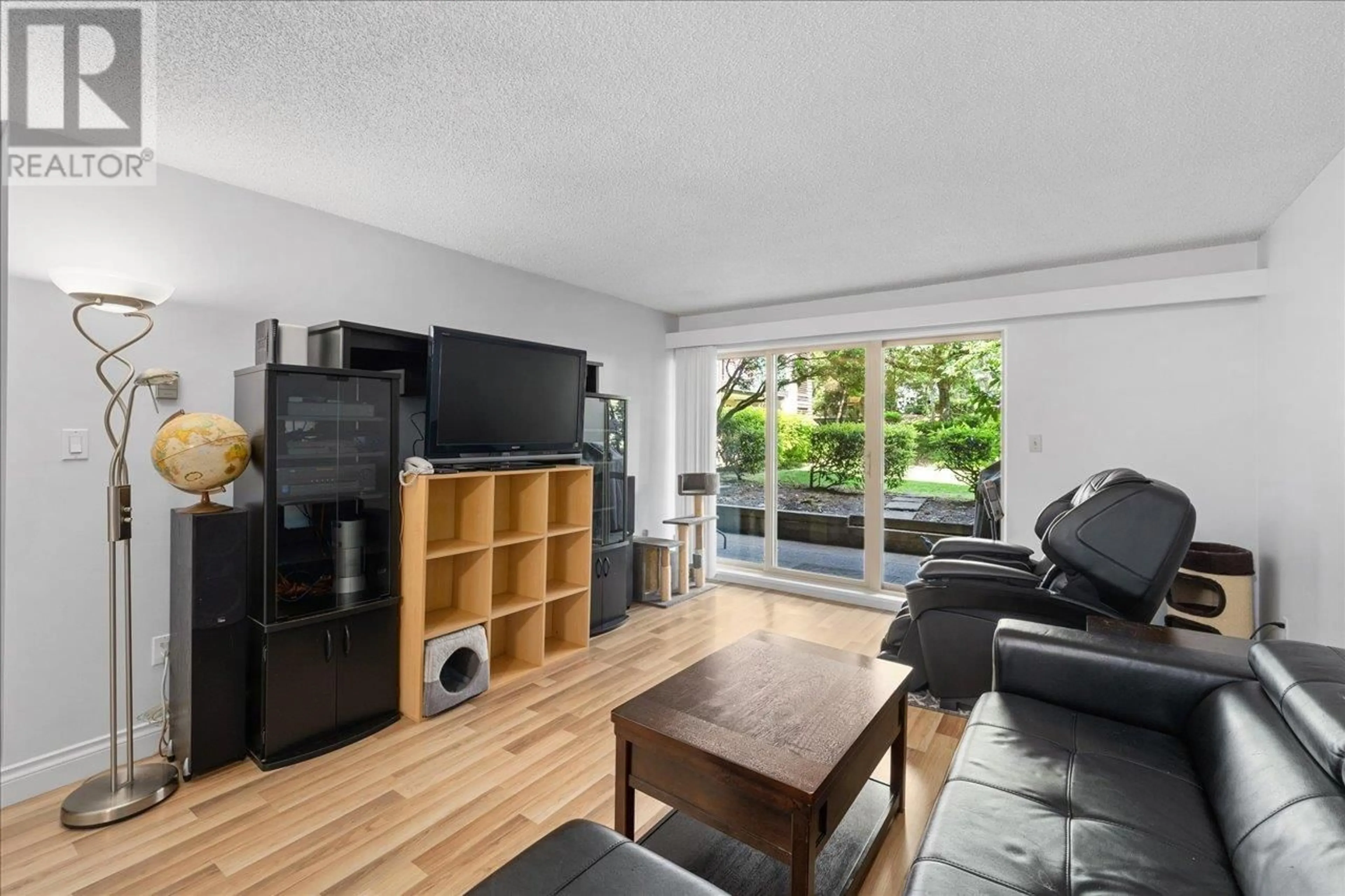 Living room with furniture, wood/laminate floor for 107 - 9847 MANCHESTER DRIVE, Burnaby British Columbia V5A2C3