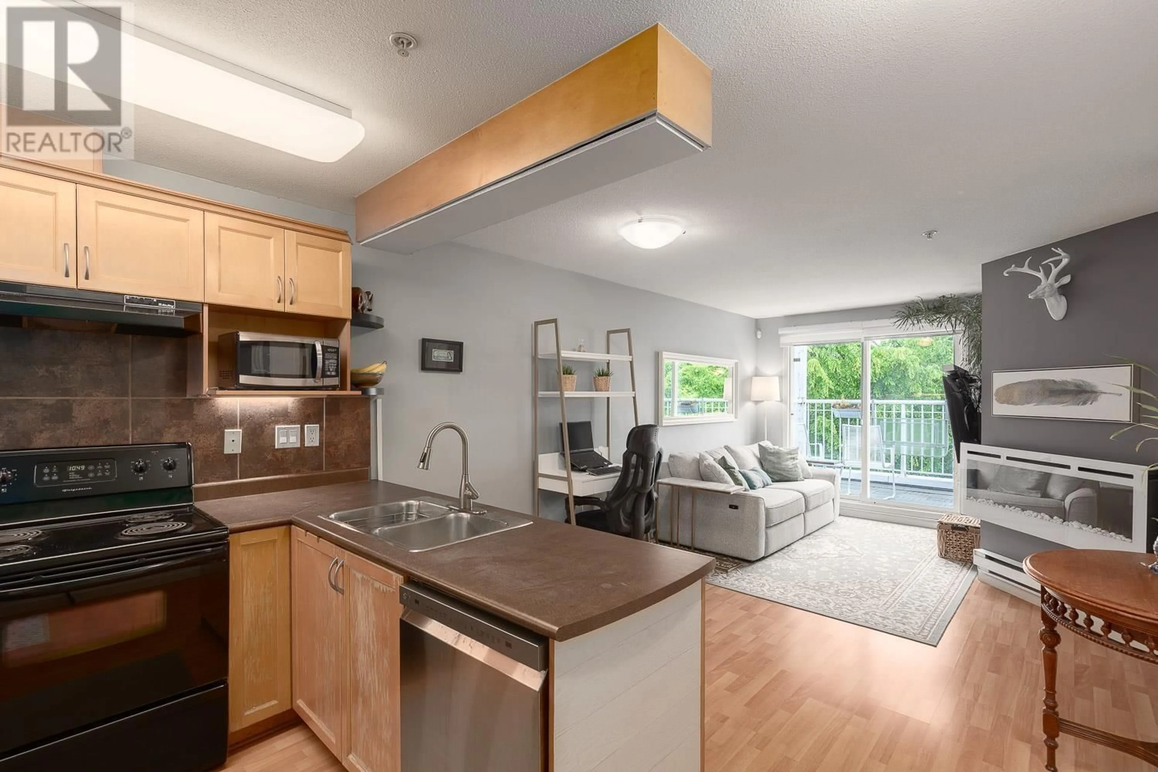 Open concept kitchen, wood/laminate floor for 406 - 189 ONTARIO PLACE, Vancouver British Columbia V5W4C6