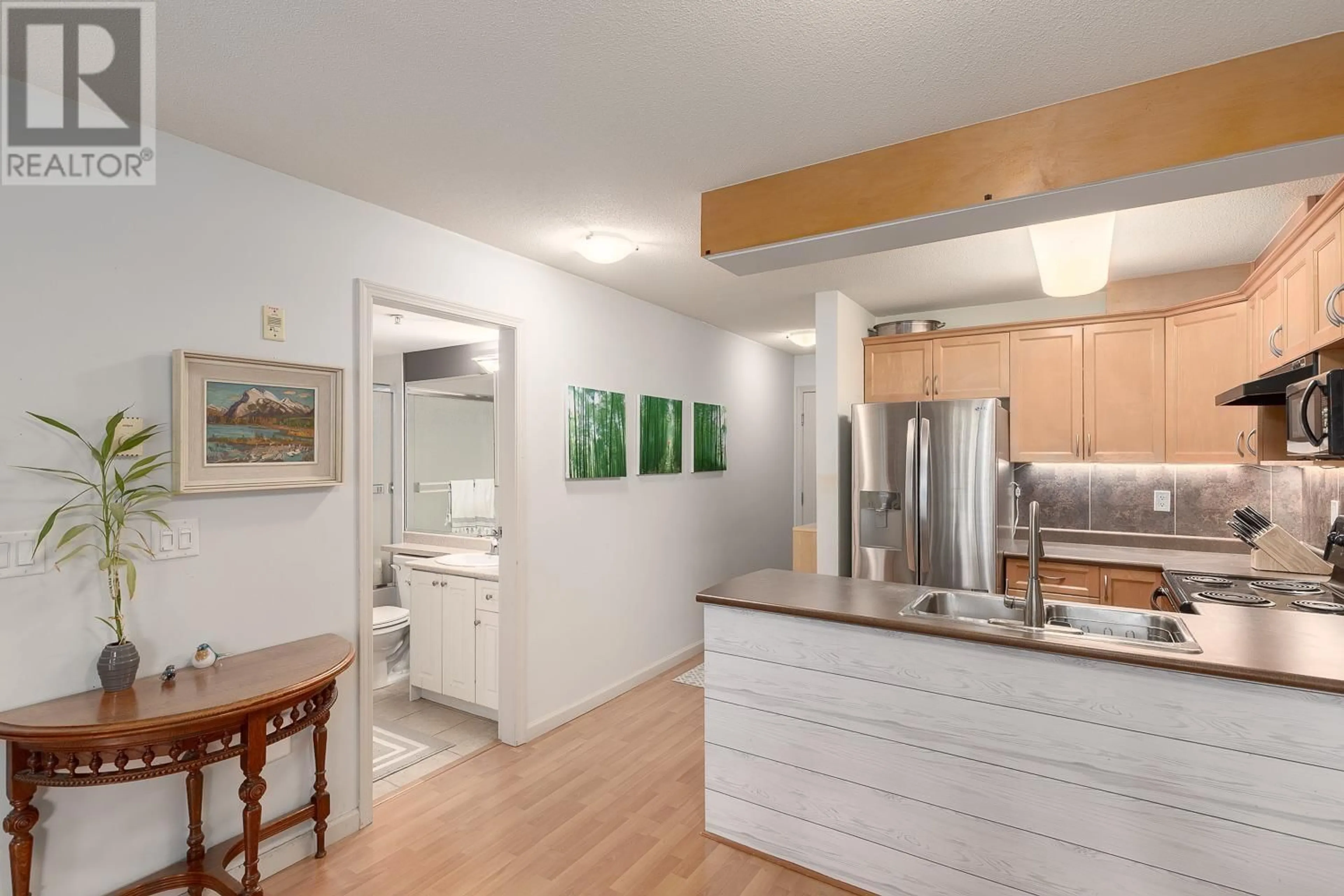 Open concept kitchen, wood/laminate floor for 406 - 189 ONTARIO PLACE, Vancouver British Columbia V5W4C6