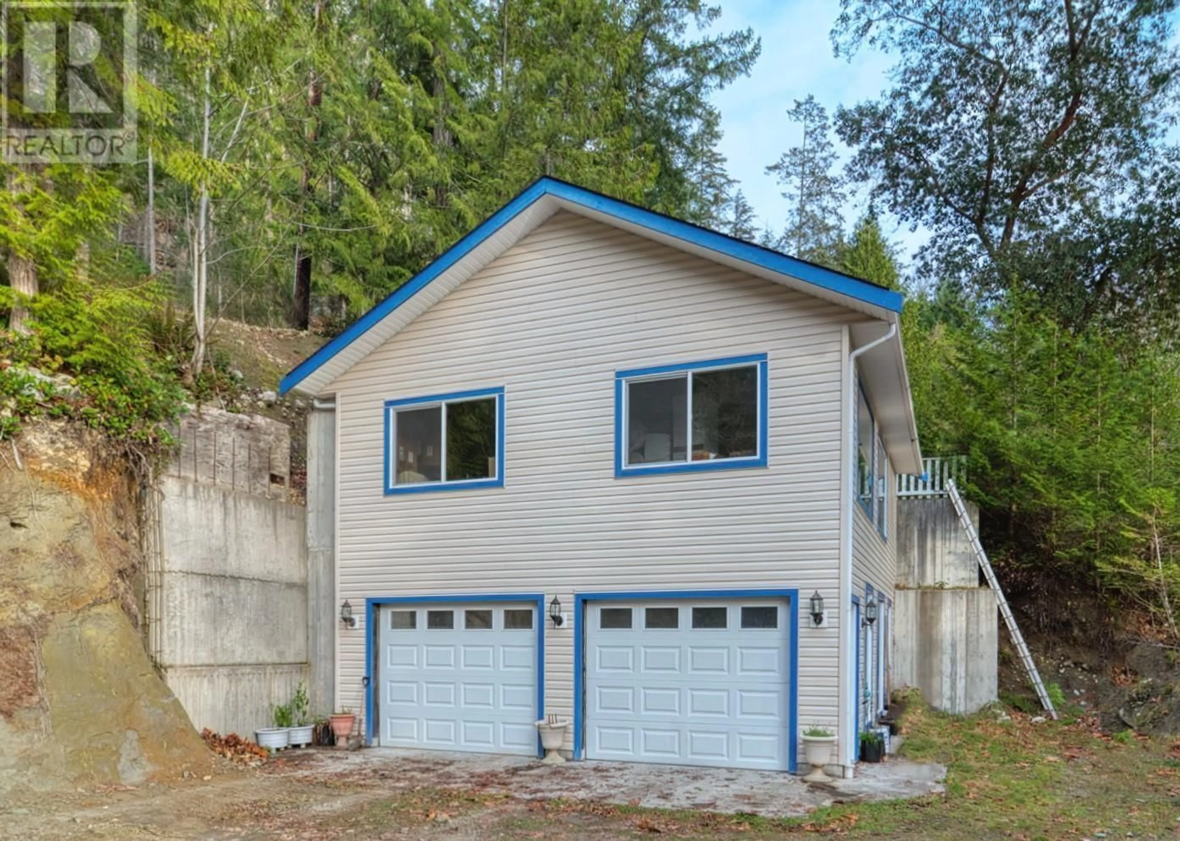 Home with vinyl exterior material, street for 5338 DANIEL ROAD, Garden Bay British Columbia V0N1S1