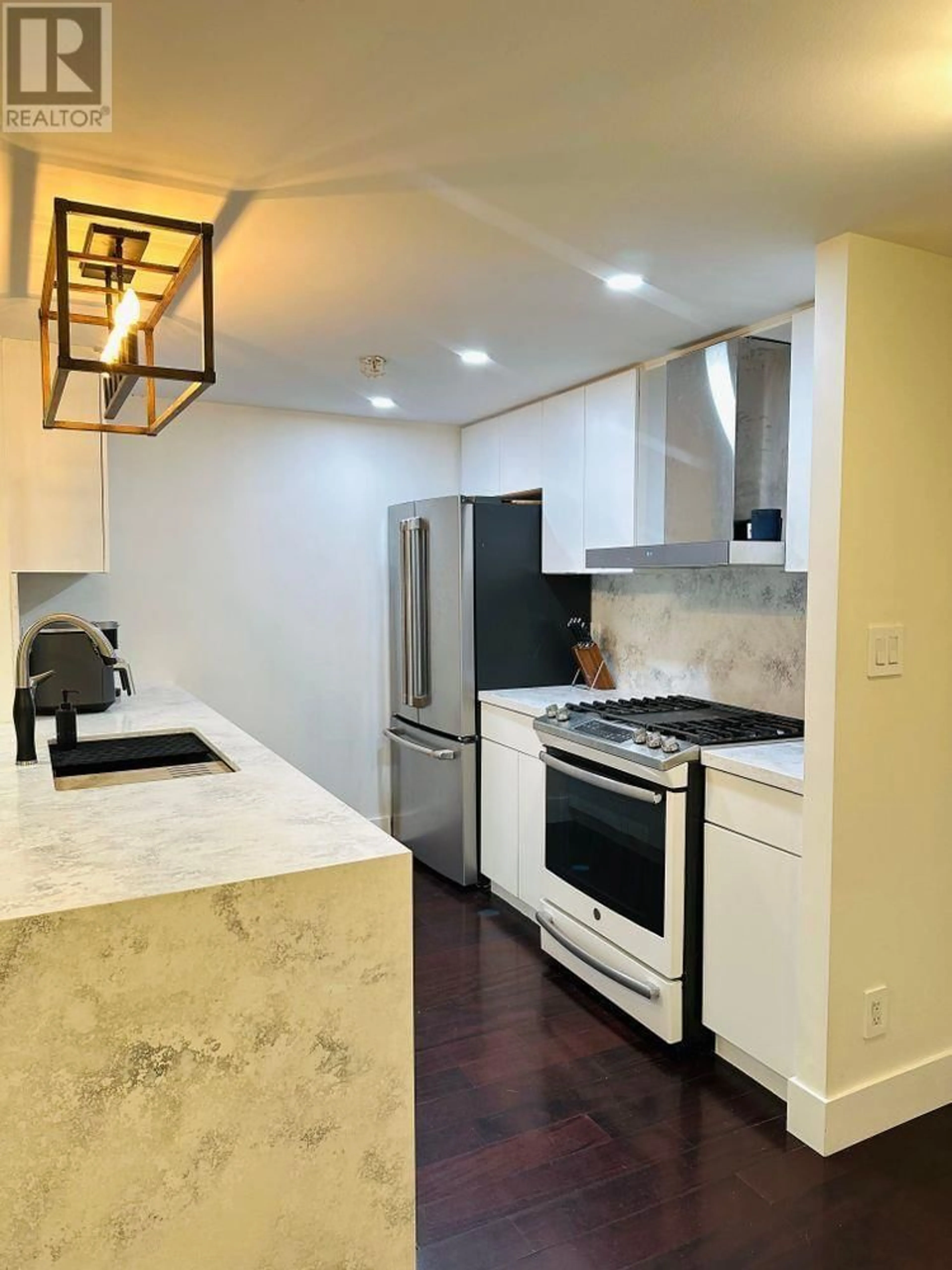 Open concept kitchen, ceramic/tile floor for 202 - 1033 MARINASIDE CRESCENT, Vancouver British Columbia V6Z3A3