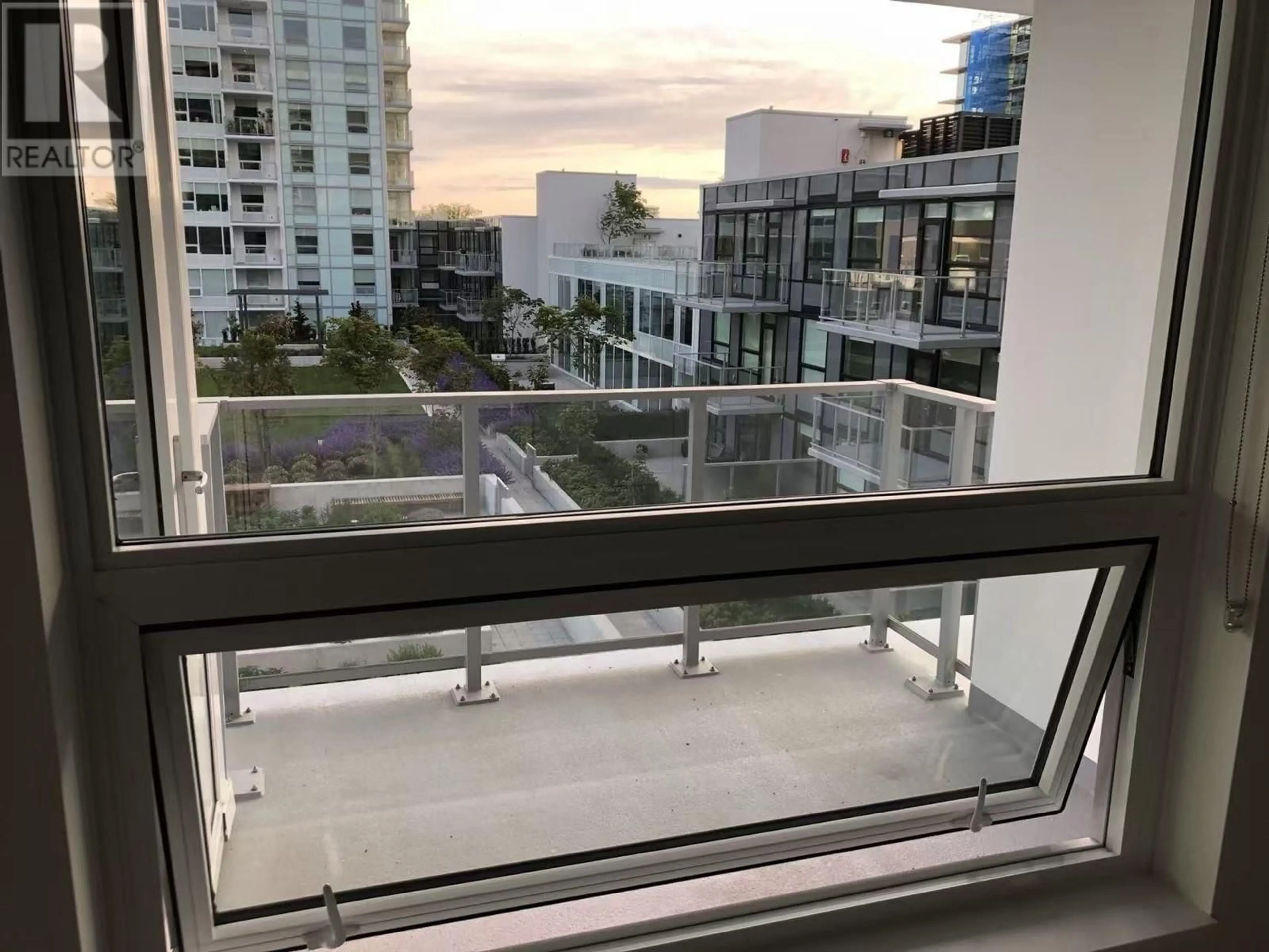 Balcony in the apartment, city buildings view from balcony for 604 - 6900 PEARSON WAY, Richmond British Columbia V7C0C9