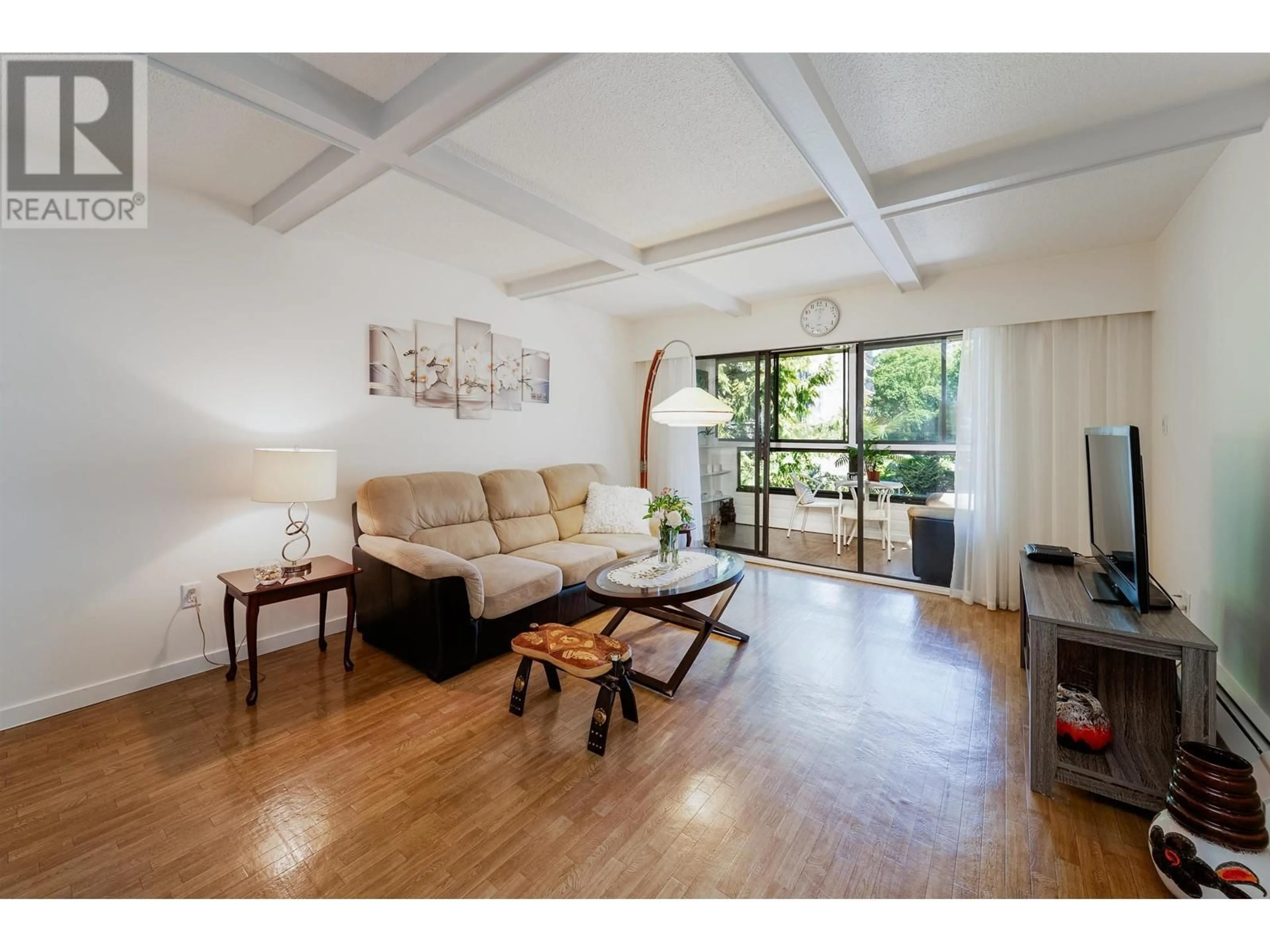 Living room with furniture, wood/laminate floor for 409 - 1435 NELSON STREET, Vancouver British Columbia V6G2Z3