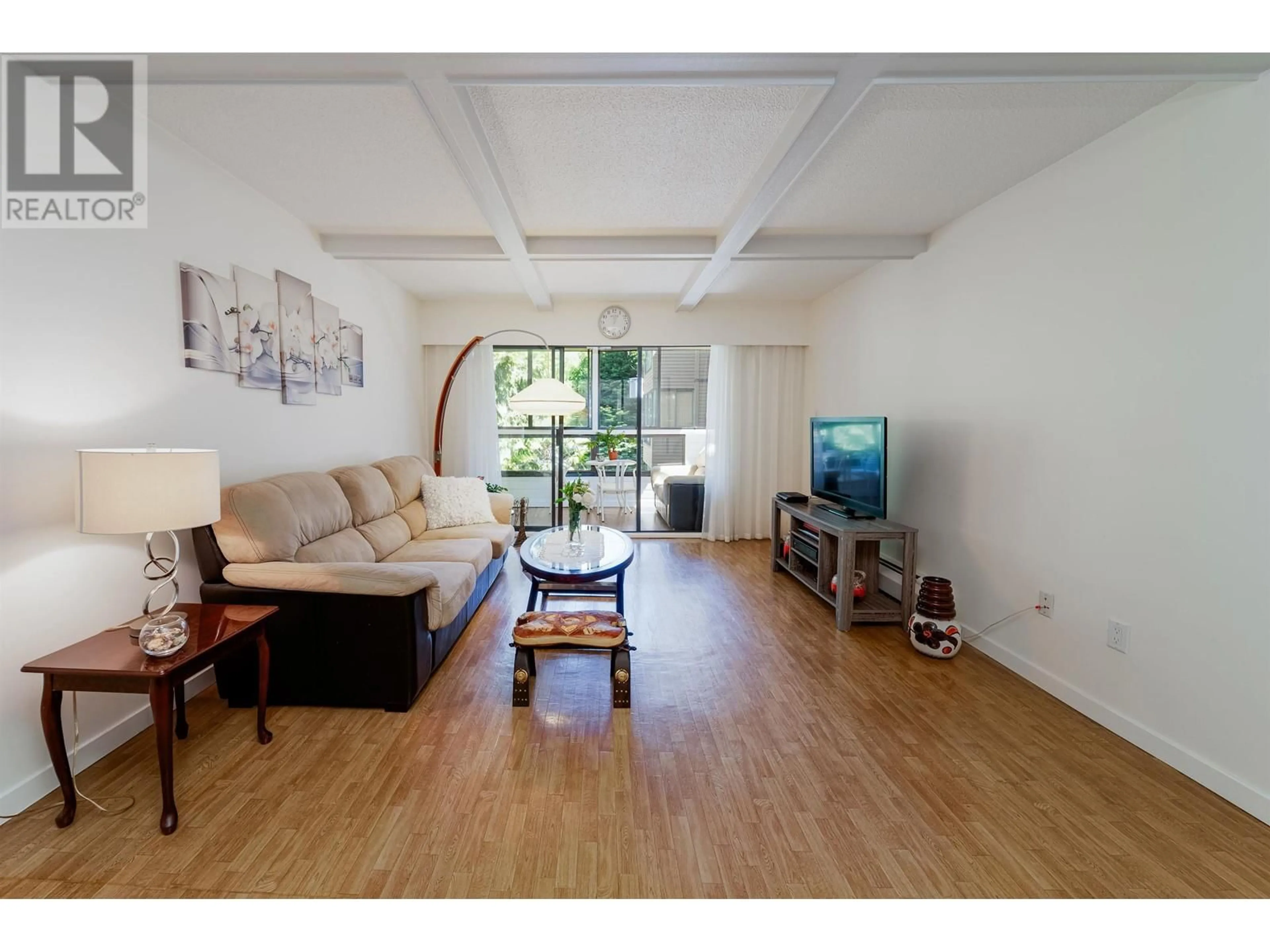 Living room with furniture, wood/laminate floor for 409 - 1435 NELSON STREET, Vancouver British Columbia V6G2Z3