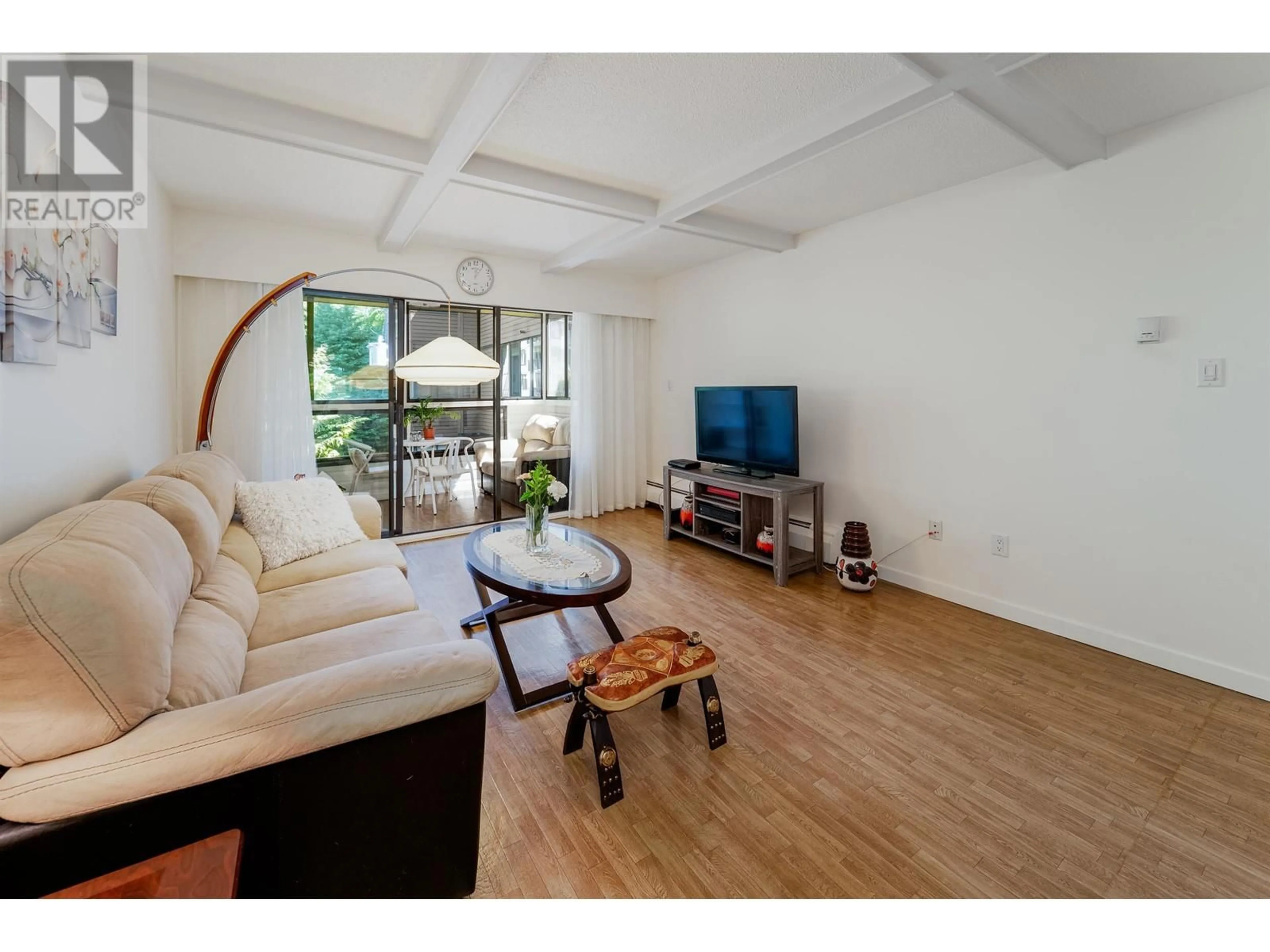 Living room with furniture, wood/laminate floor for 409 - 1435 NELSON STREET, Vancouver British Columbia V6G2Z3