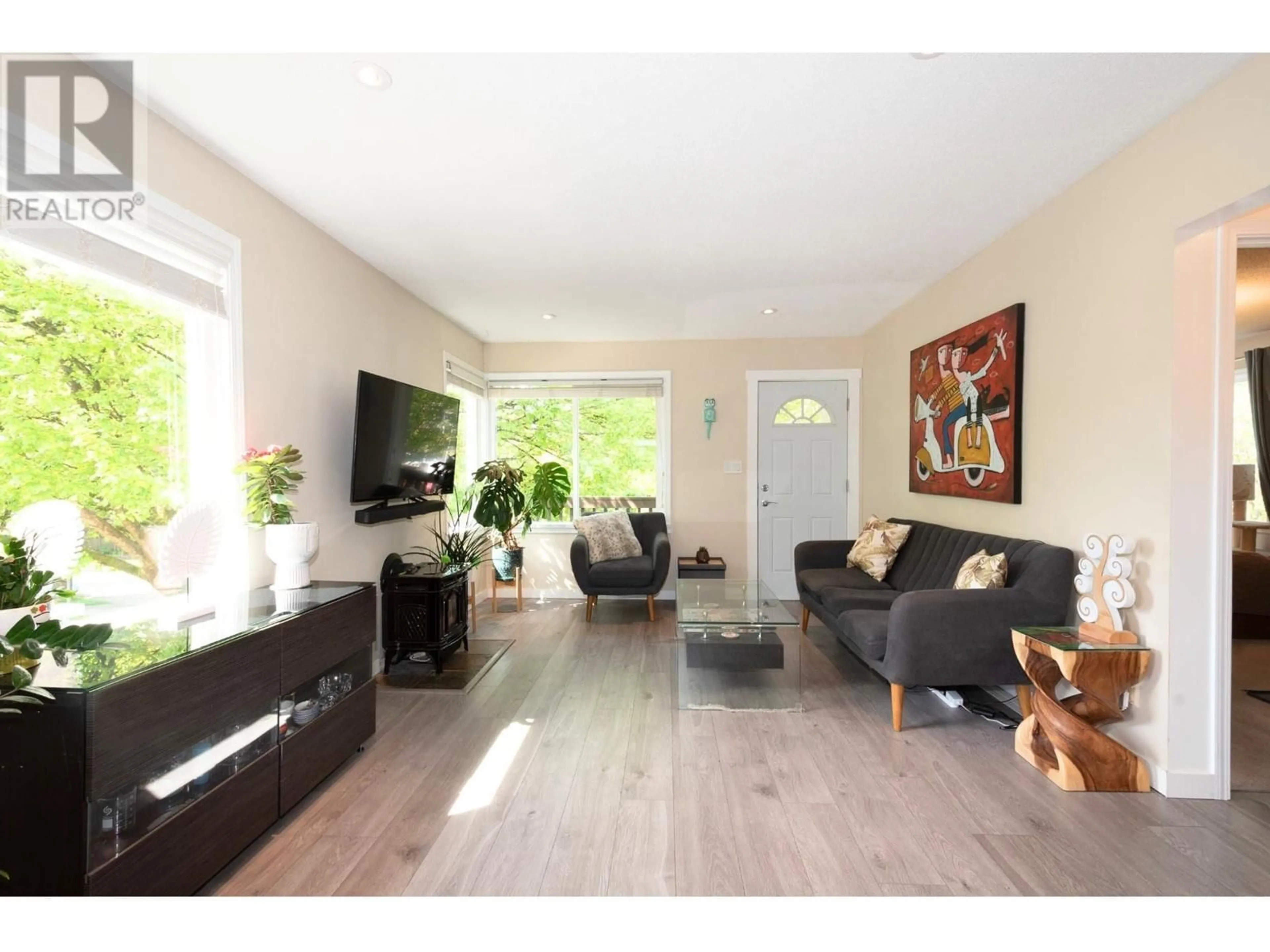 Living room with furniture, wood/laminate floor for 696 RUPERT STREET, Vancouver British Columbia V5K4K8