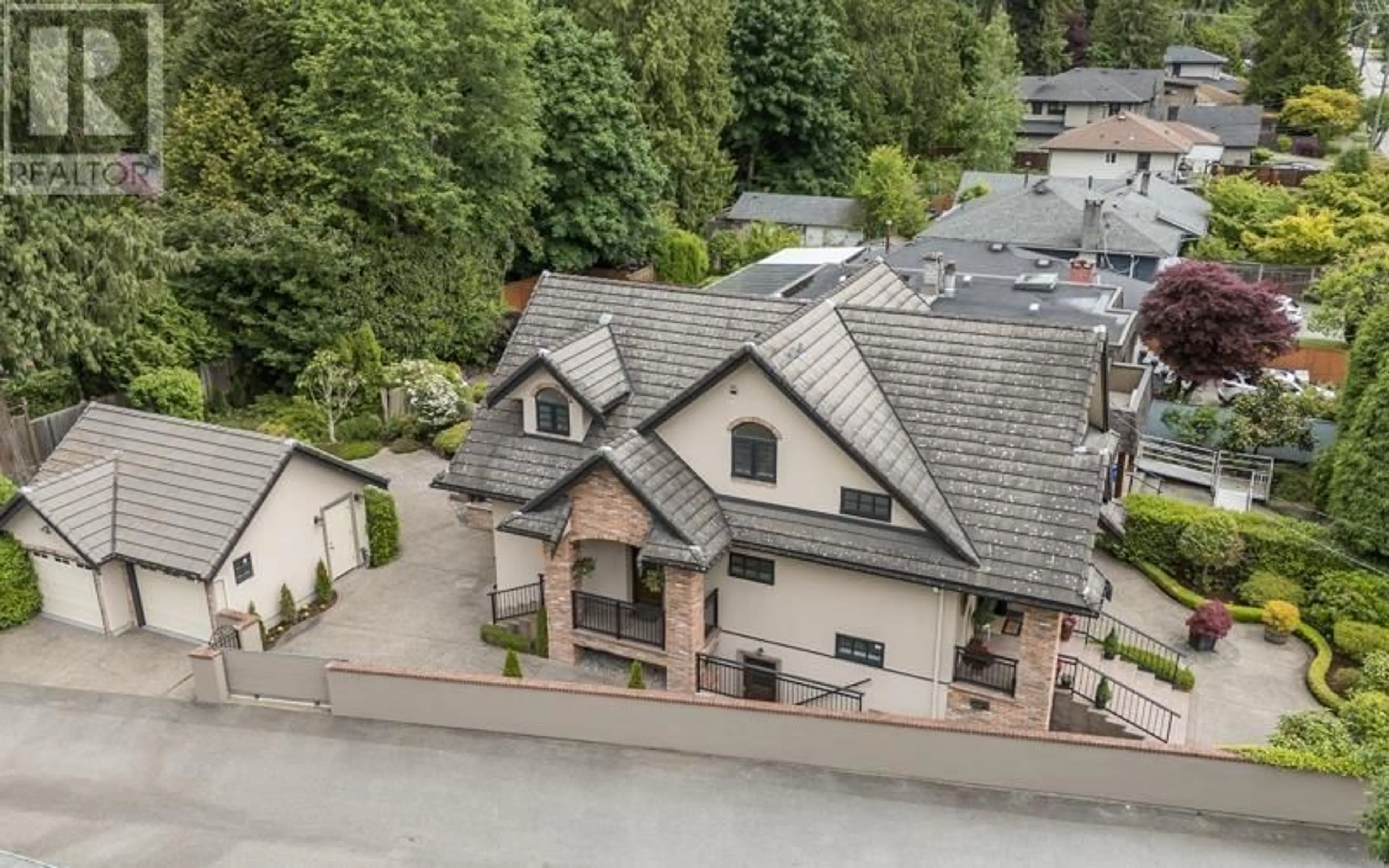 A pic from outside/outdoor area/front of a property/back of a property/a pic from drone, street for 1134 MONTROYAL BOULEVARD, North Vancouver British Columbia V7R2H7