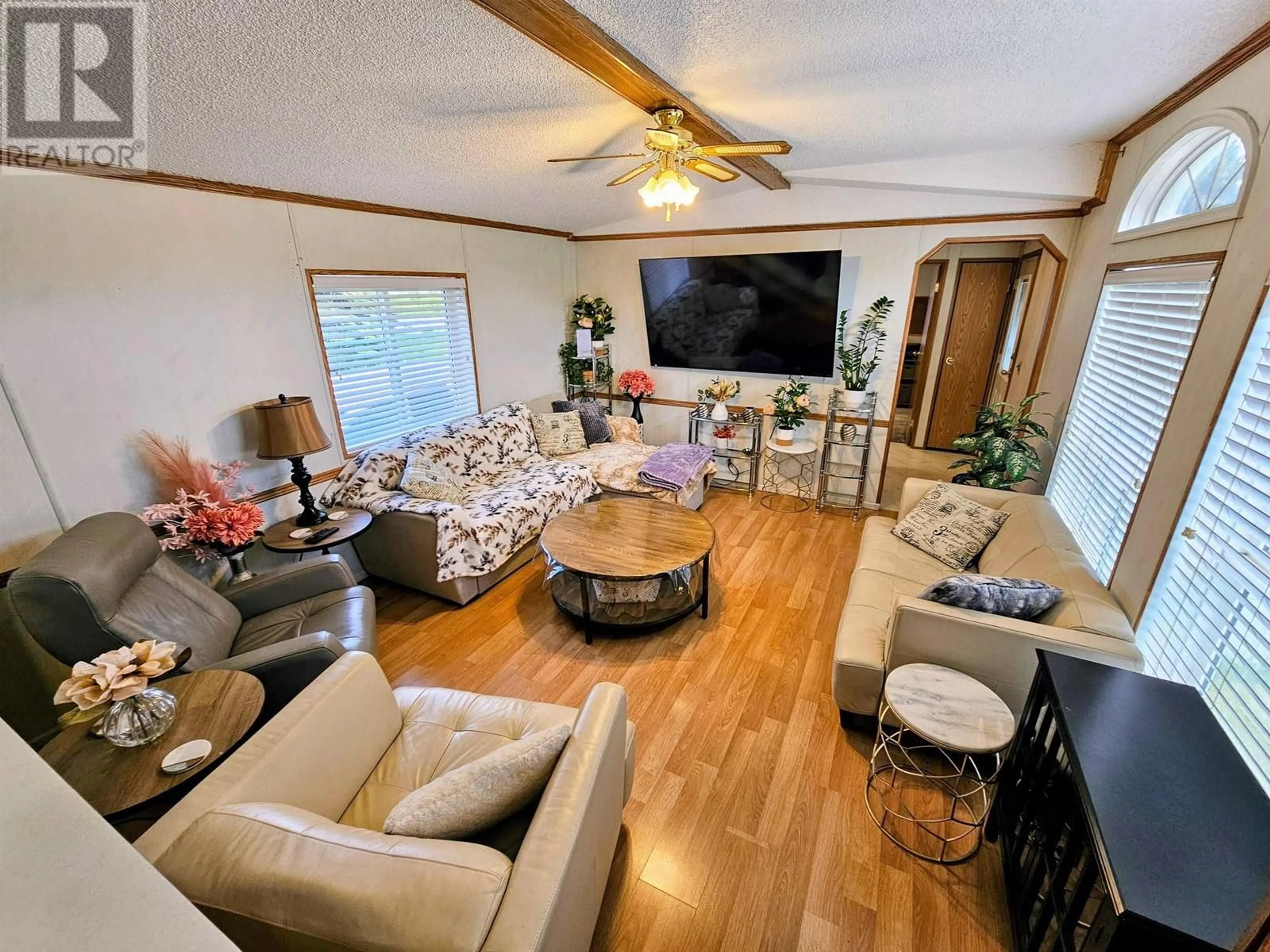 Living room with furniture, wood/laminate floor for 1 - 8622 HART HIGHWAY, Prince George British Columbia V2K3B7