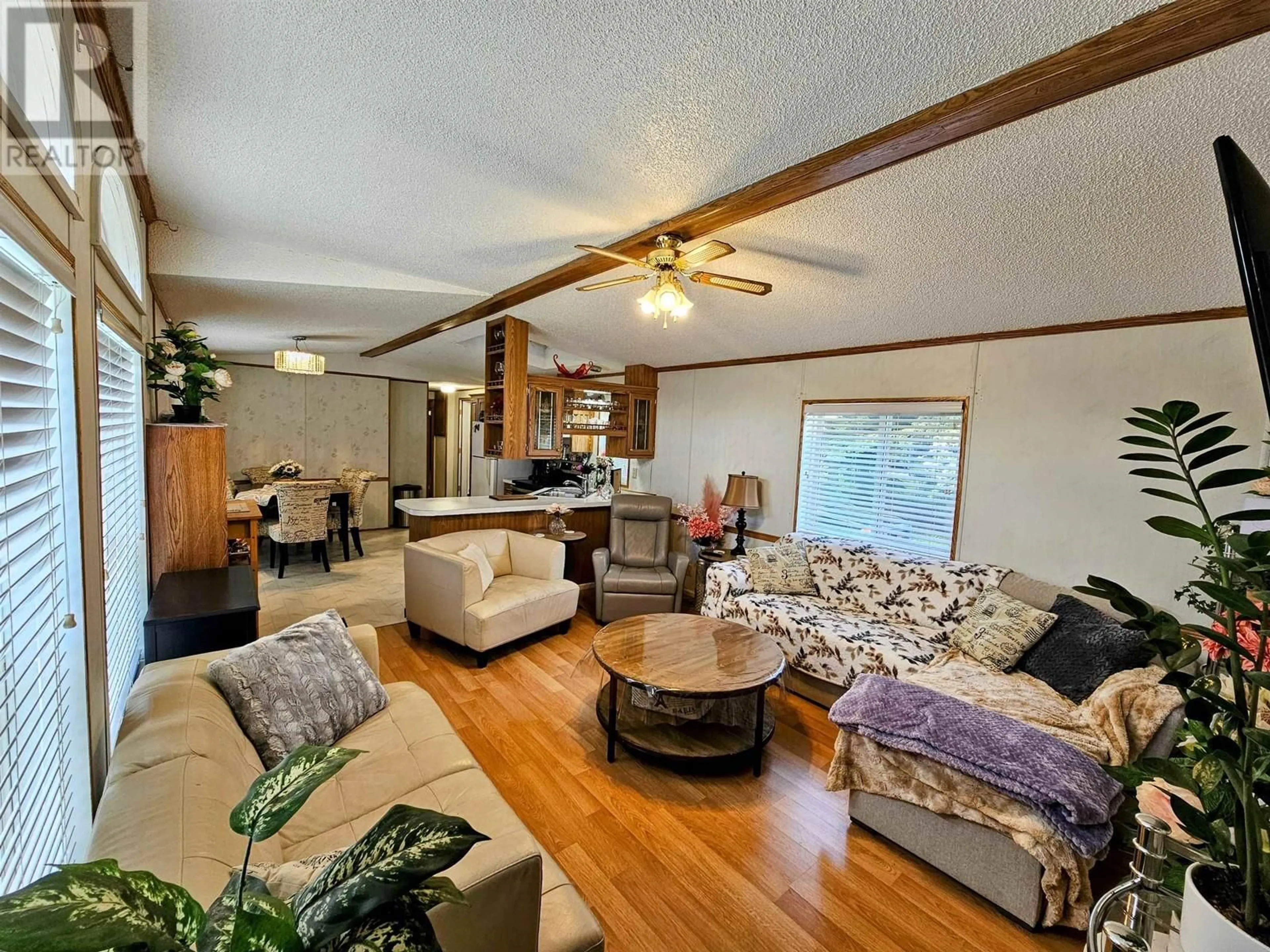 Living room with furniture, wood/laminate floor for 1 - 8622 HART HIGHWAY, Prince George British Columbia V2K3B7