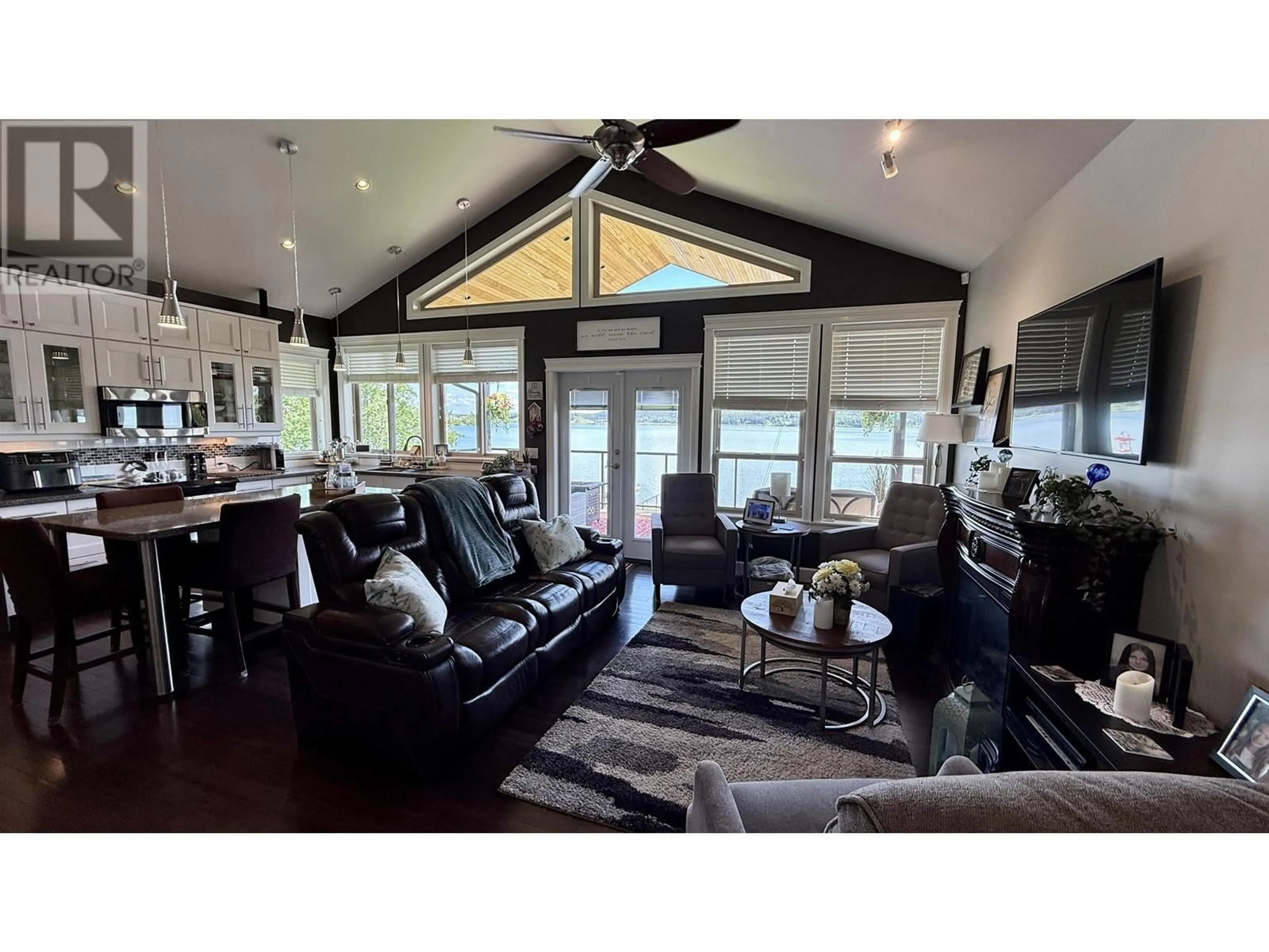Living room with furniture, wood/laminate floor for 4828 HAMILTON ROAD, Lac La Hache British Columbia V0K1T0