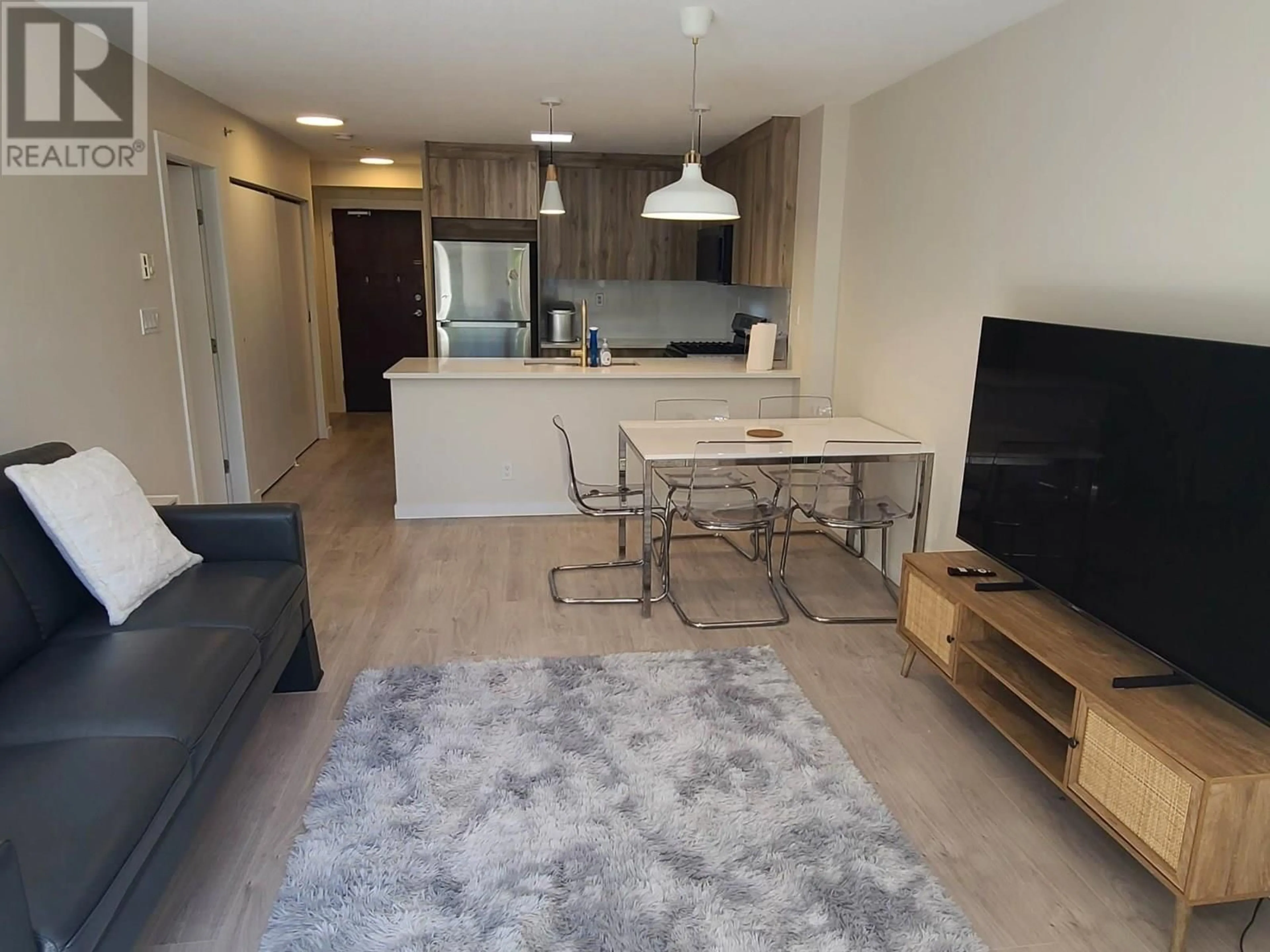 Living room with furniture, wood/laminate floor for 512 - 7831 WESTMINSTER HIGHWAY, Richmond British Columbia V6X1A4