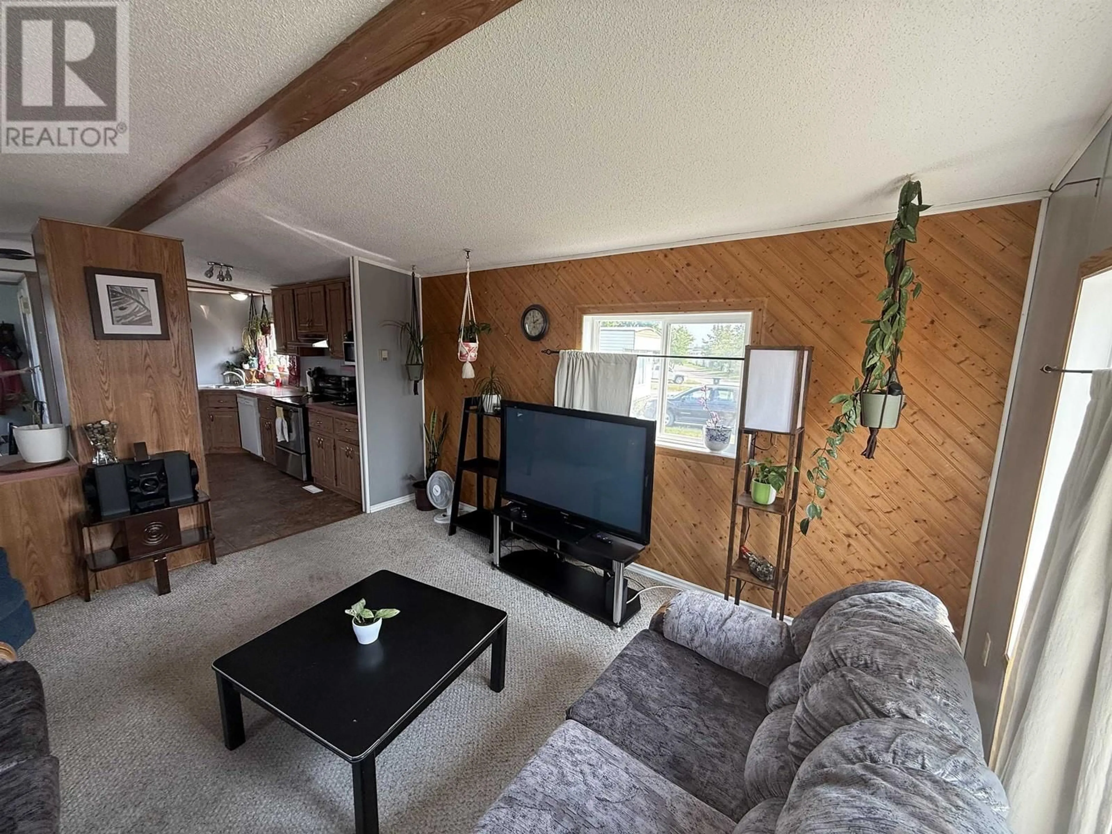 Living room with furniture, wood/laminate floor for 31 - 8420 ALASKA ROAD, Fort St. John British Columbia V1J4J6