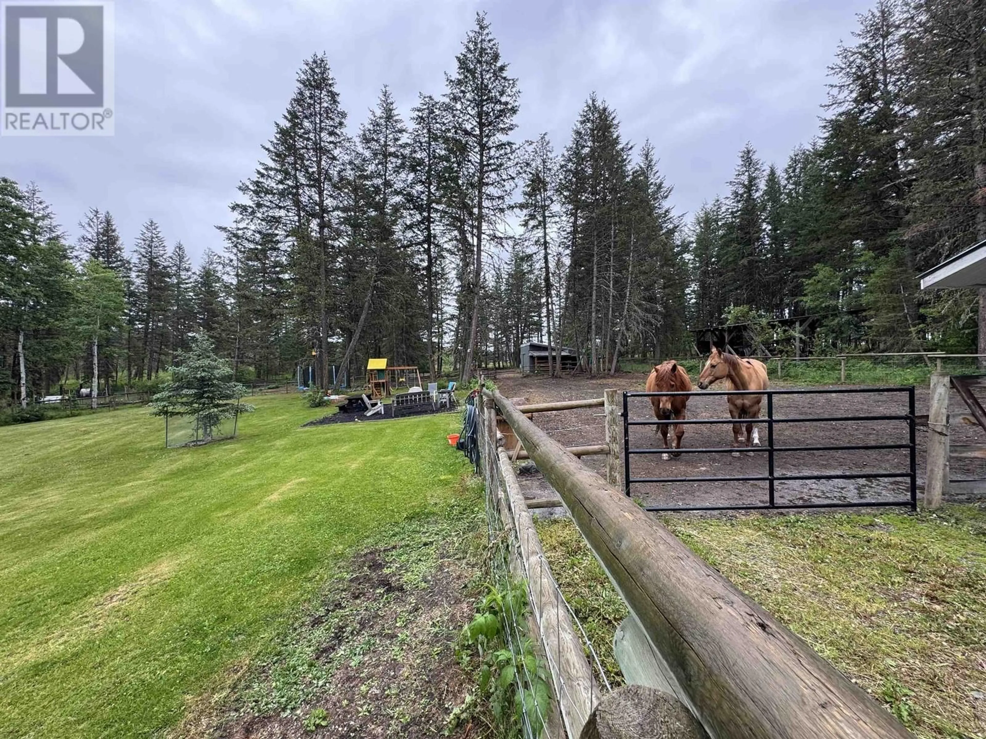 A pic from outside/outdoor area/front of a property/back of a property/a pic from drone, forest/trees view for 3078 HEINIE PLACE, 150 Mile House British Columbia V0K2G0