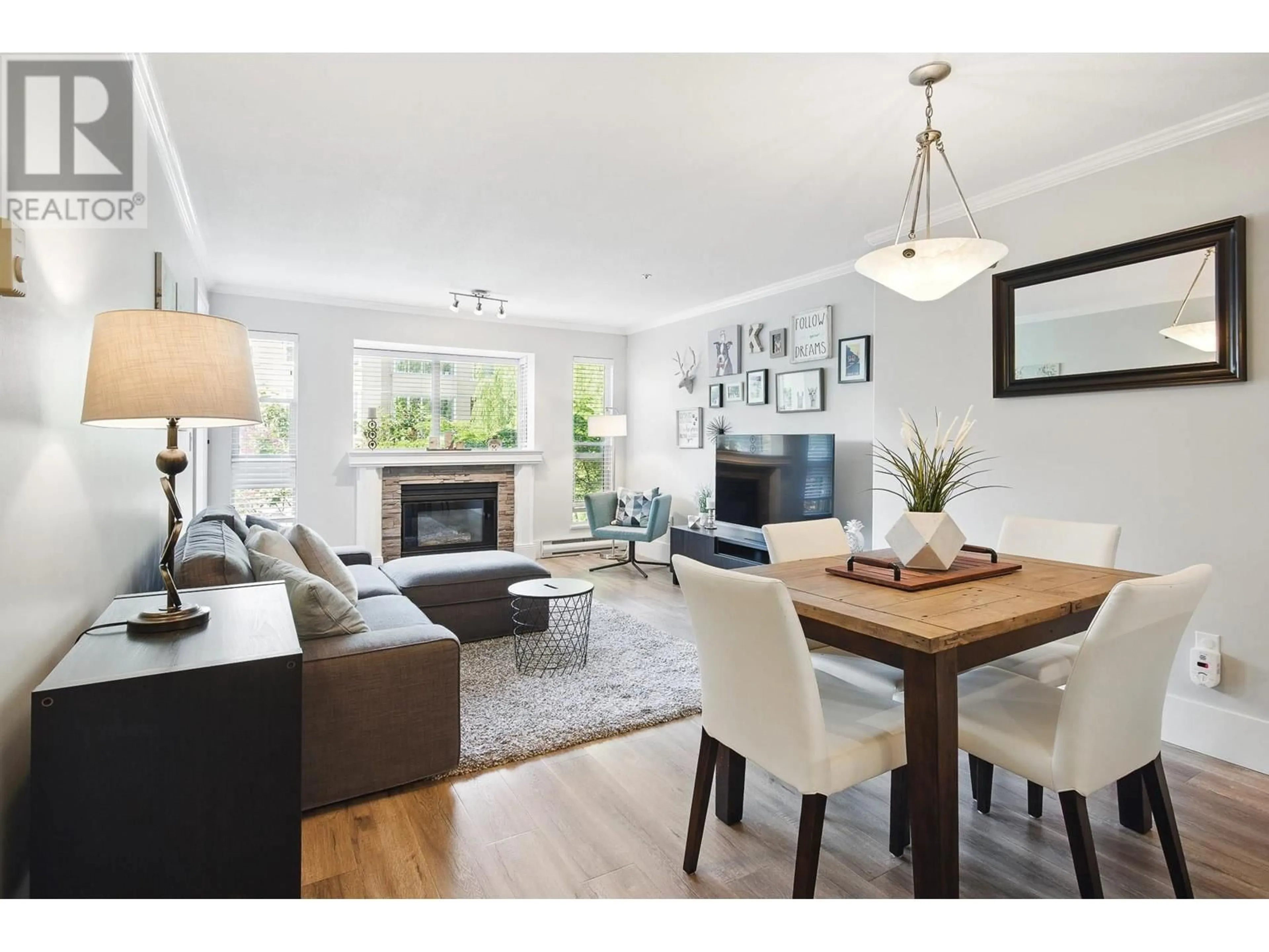 Living room with furniture, wood/laminate floor for 204 - 2345 CENTRAL AVENUE, Port Coquitlam British Columbia V3C1V9