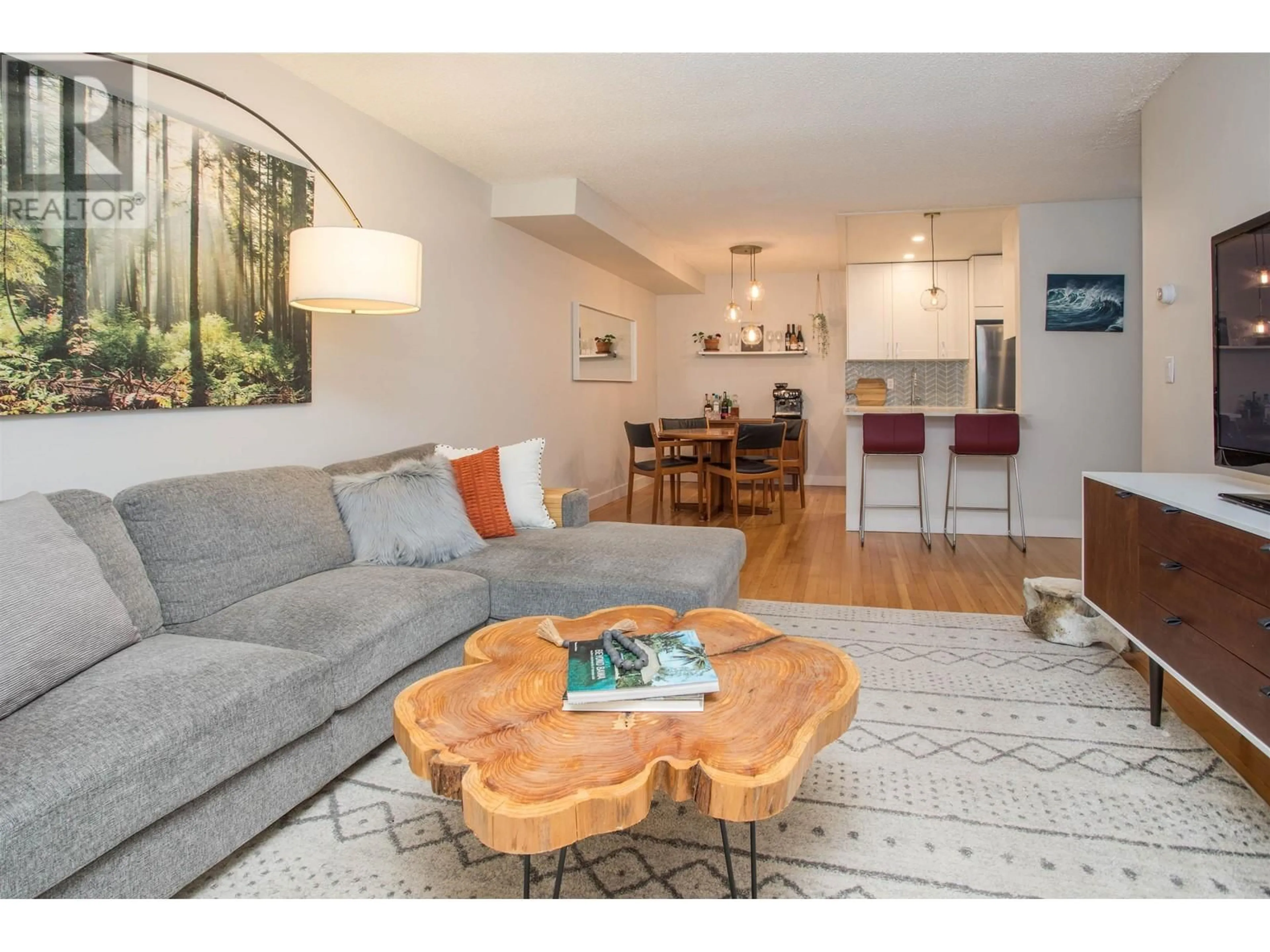 Living room with furniture, wood/laminate floor for 113 - 330 7TH AVENUE, Vancouver British Columbia V5T4K5