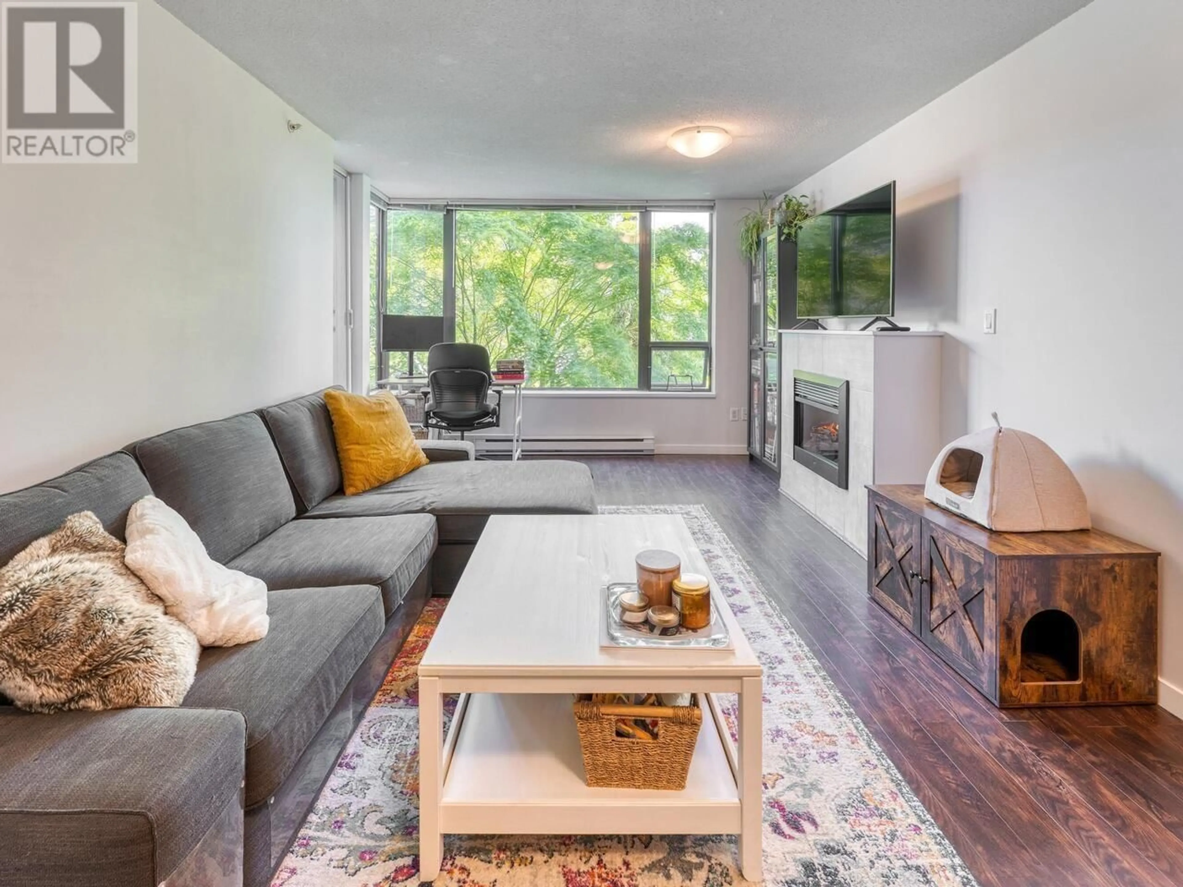 Living room with furniture, wood/laminate floor for 405 - 4118 DAWSON STREET, Burnaby British Columbia V5C0A3